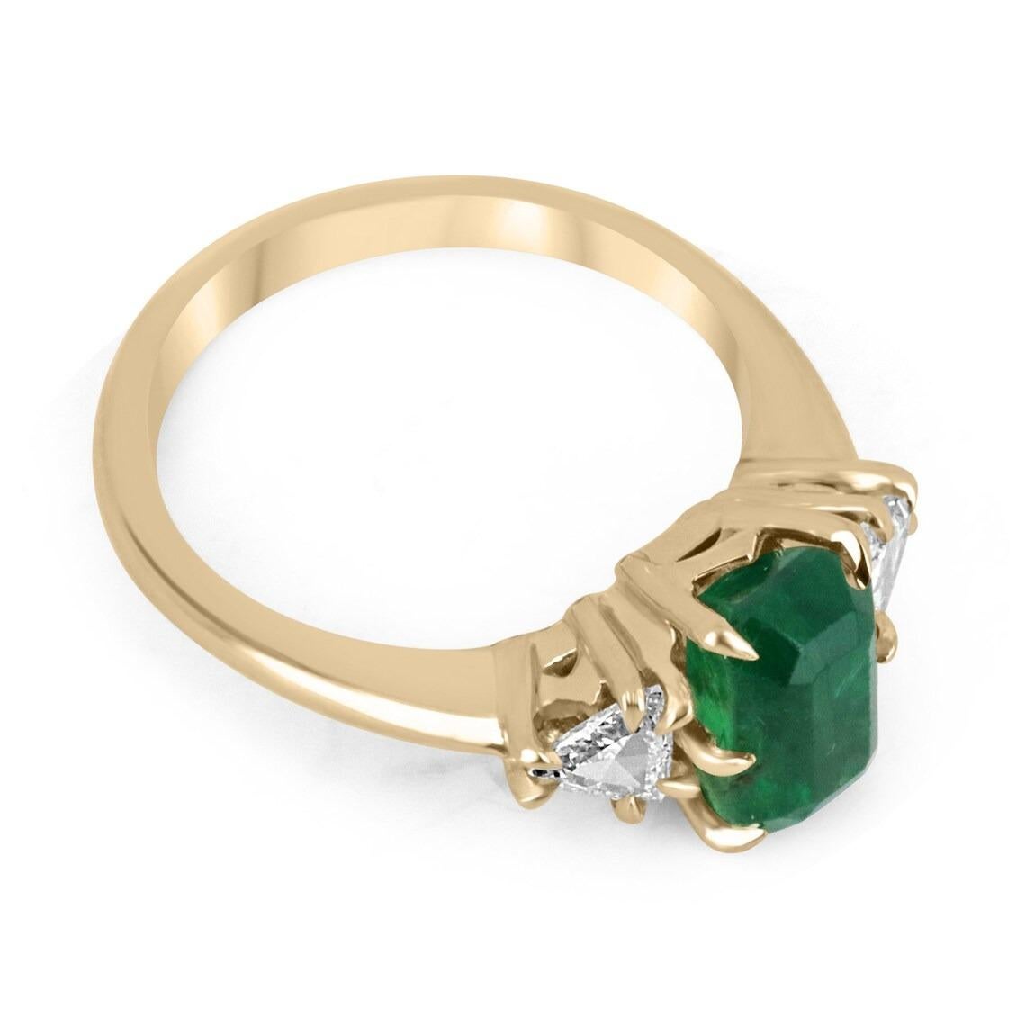 A special emerald and rose cut trillion diamond three-stone ring. Dexterously crafted in gleaming 18K gold this ring features an old-cut emerald from Zambia. Set in a bespoke six-prong setting, this extraordinary emerald has a bright green color and