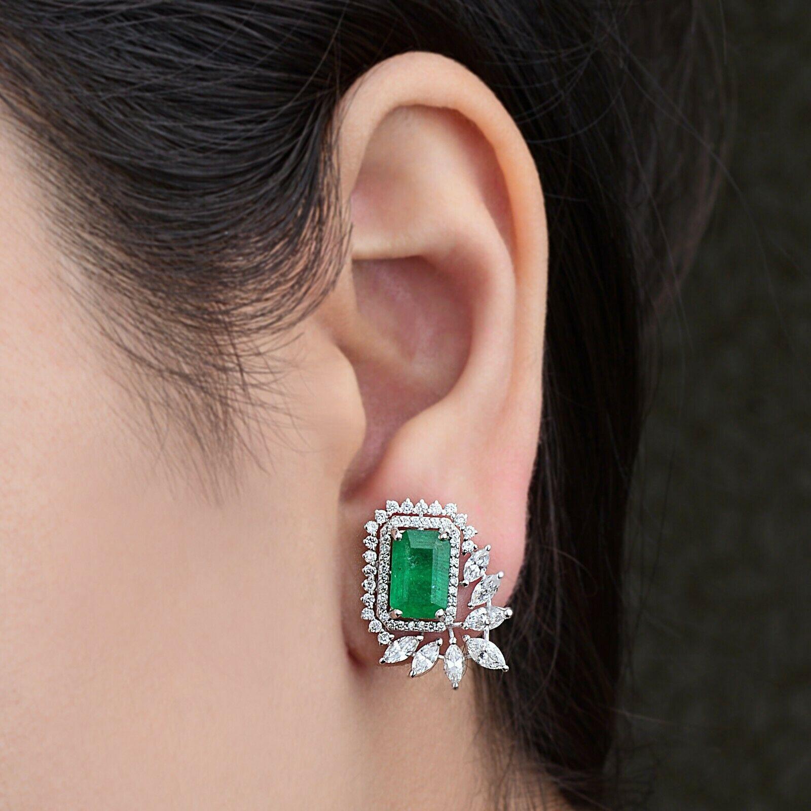Cast in 14 karat gold, these stud earrings are hand set with 3.06 carats emerald and 2.40 carats of glimmering diamonds. 

FOLLOW MEGHNA JEWELS storefront to view the latest collection & exclusive pieces. Meghna Jewels is proudly rated as a Top