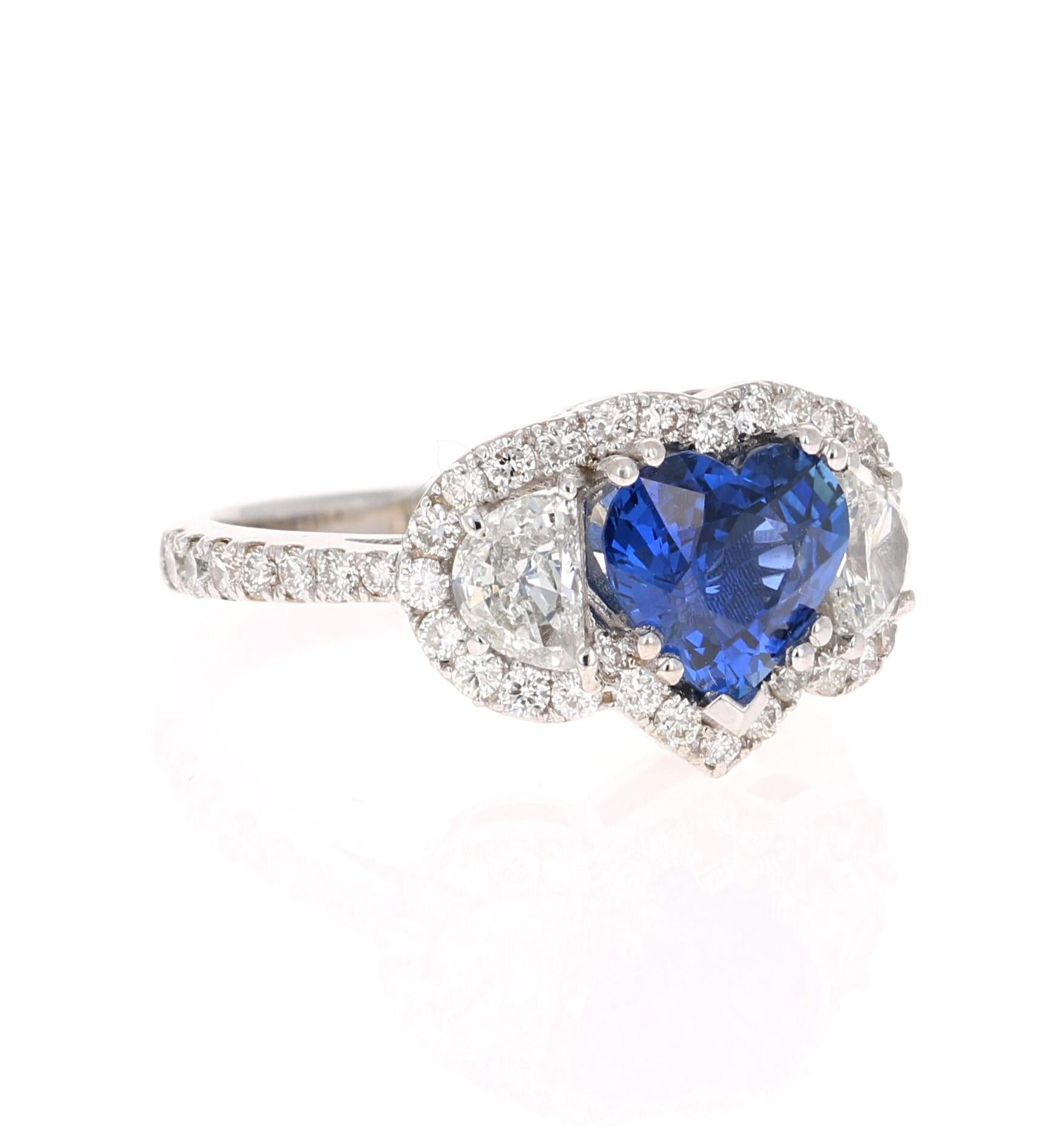 This ring has a gorgeous Heart Cut Blue Sapphire that weighs 1.93 Carats and is GIA Certified. The Sapphire is a natural Blue Heart Cut with Heat as per industry standards. The GIA Certificate Number is: 5182981580. 
It is embellished with 2 Half