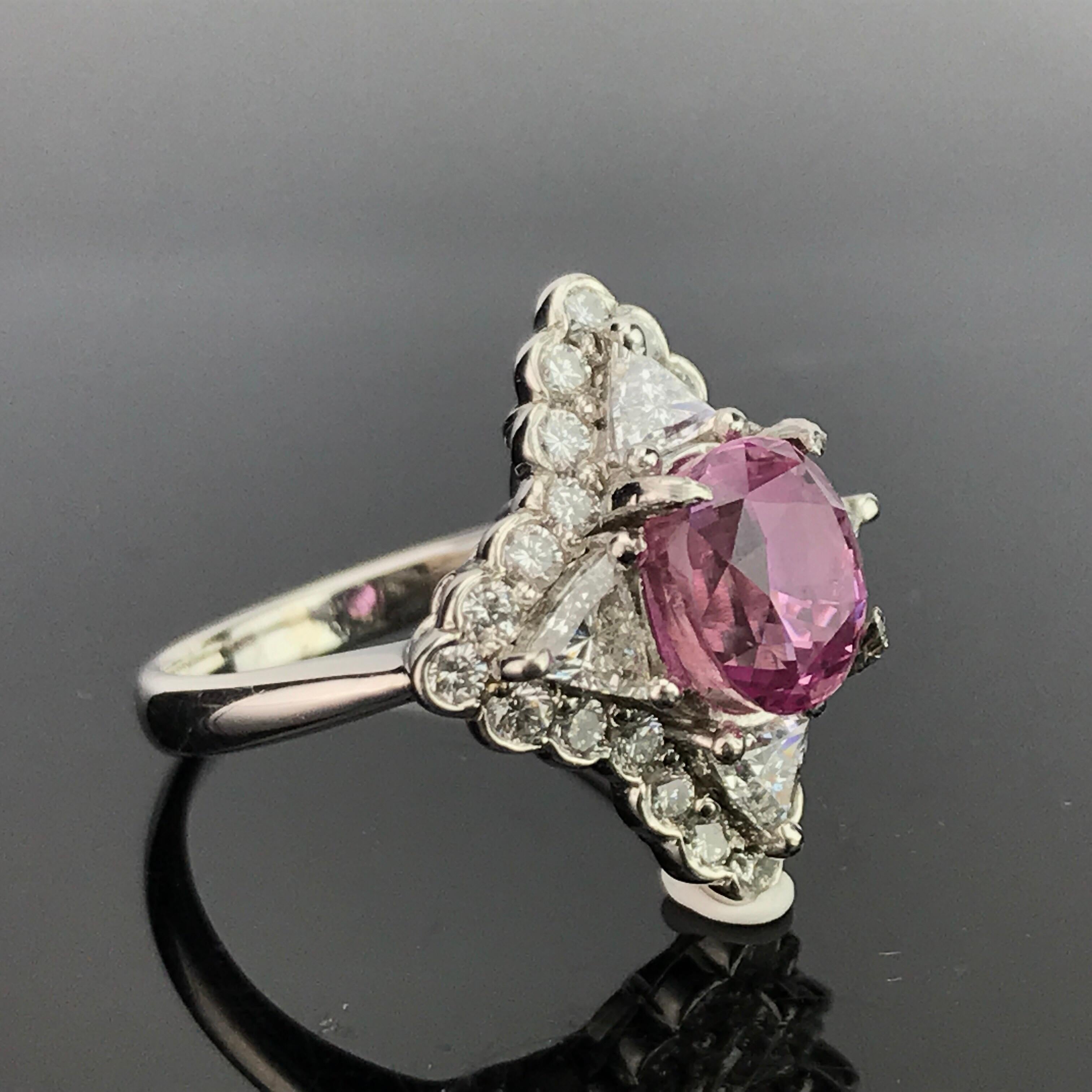 An art-deco looking, statement 3.06 carat oval shaped rare pink Paparadscha cocktail ring, set with white Diamonds in Platinum. Current ring size of US 6 can be changed, without any additional charges.

Stone Details: 
Stone: Pink Paparadscha