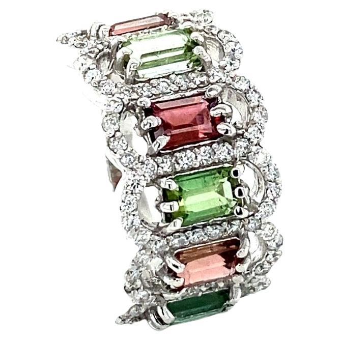 3.06 Carat Tourmaline Diamond White Gold Cocktail Band

This gorgeous Cocktail Band has a 6 beautiful Baguette Cut Green & Burgundy Tourmalines weighing 2.23 Carats and is surrounded by 90 Round Cut Diamonds that weigh 0.83 Carats (Clarity: SI,