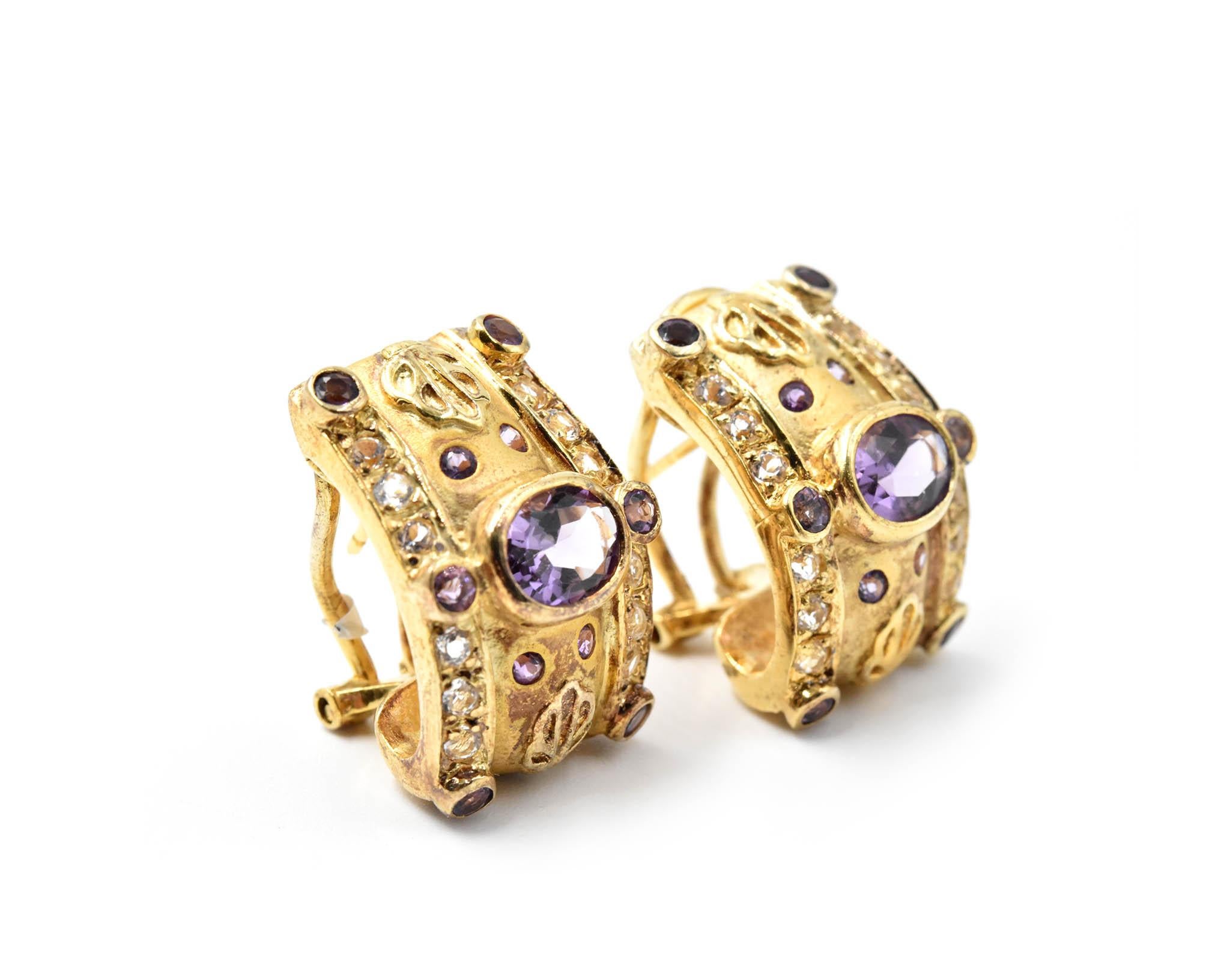 Designer: custom design
Material: sterling silver & gold plate
Amethyst: two oval cut 3.06 carat weight
White Topaz: 0.78 carat weight
Fastenings: omega clip
Weight: 18.92 grams
