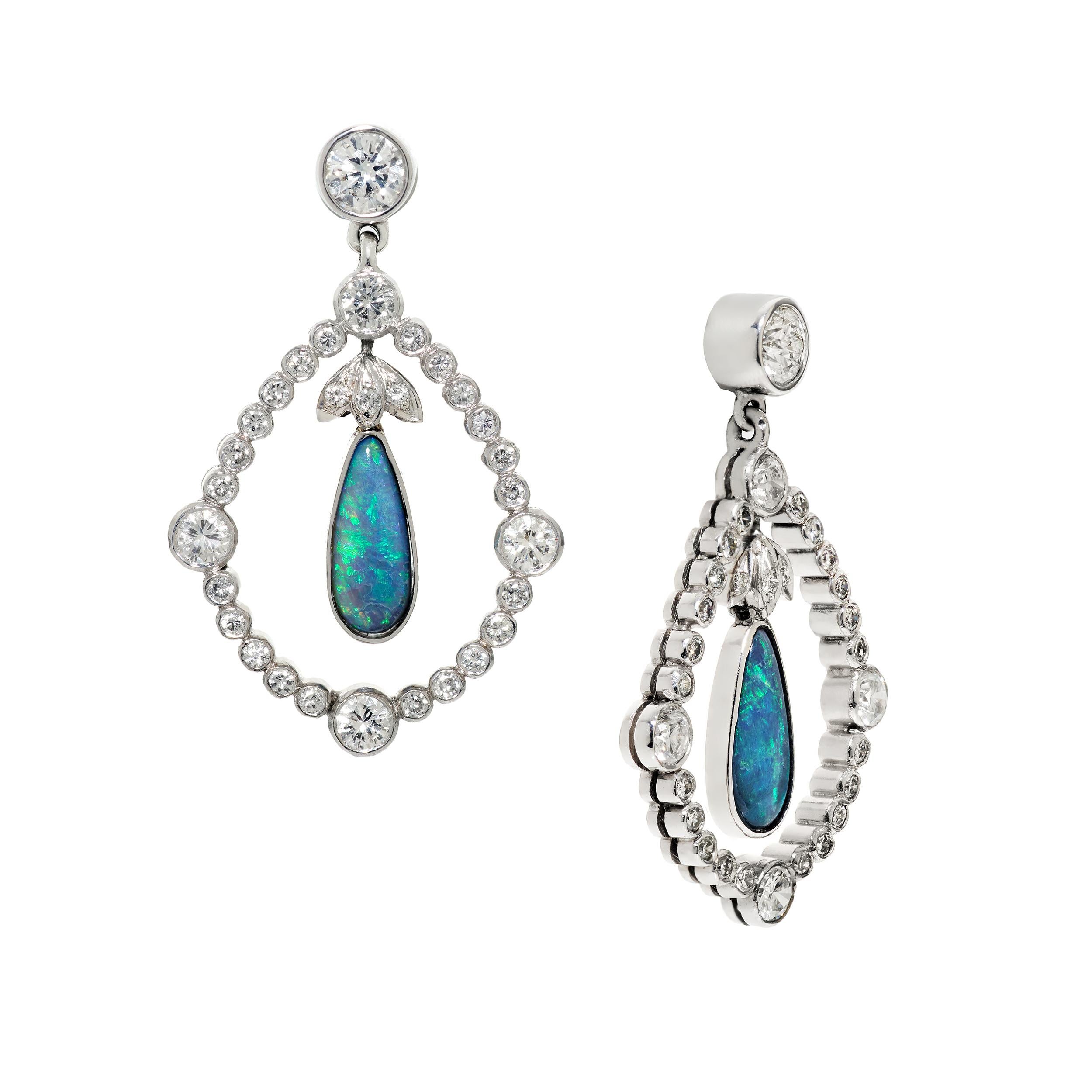 Vintage wreath earrings were the inspiration for this piece.  They were recreated in modern form by adding 1.10 Carats of Elongated Pear-shaped Black Opals and the addition of more Diamonds weighing approximately 1.96 Carats.  Total gem weight is