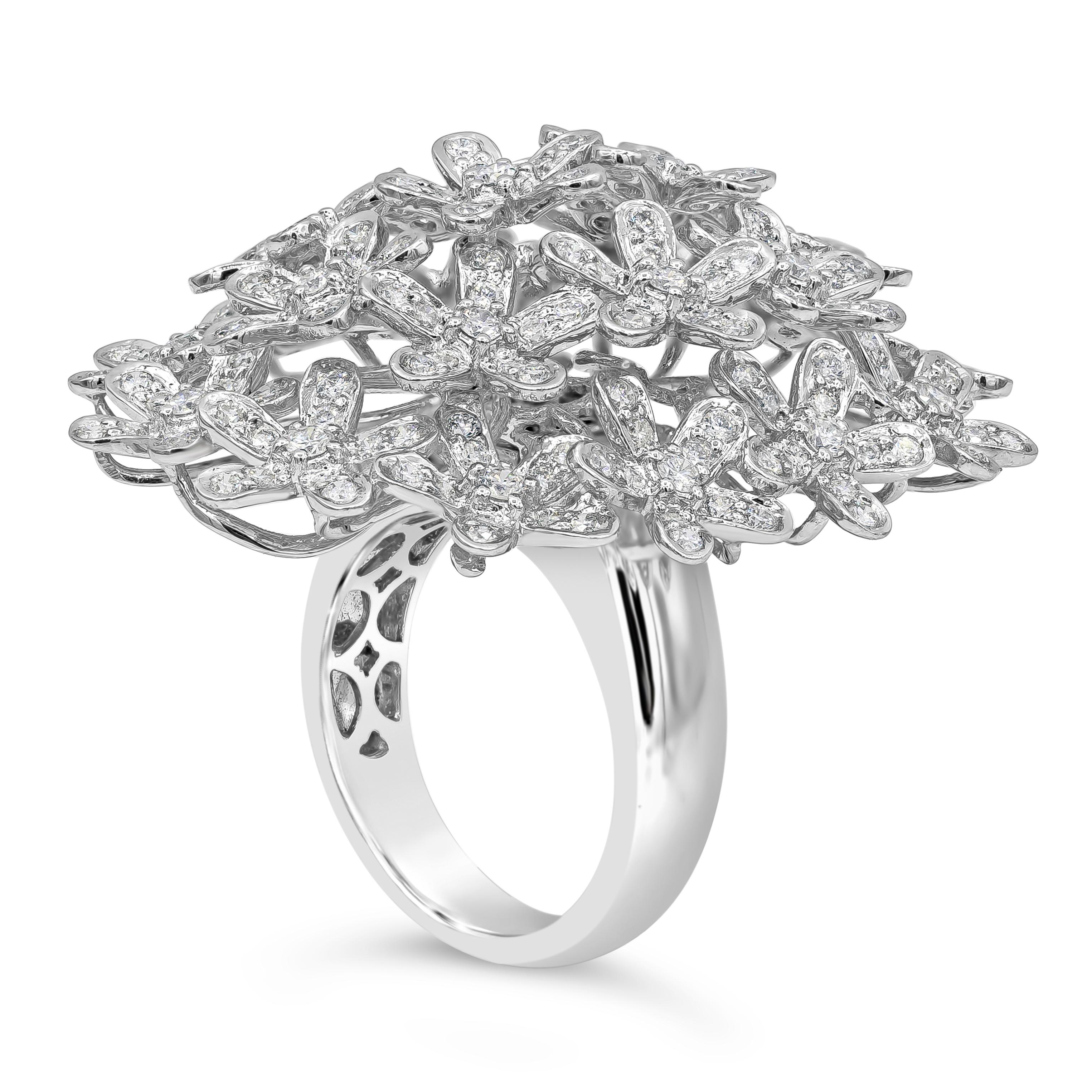 This fashionable and stylish fashion ring showcases 242 pieces of brilliant round cut diamonds weighing 3.06 carats total, beautifully set in an open-work floral motif design. Diamonds are finely set in a 18k white gold mounting. Size 7 US resizable