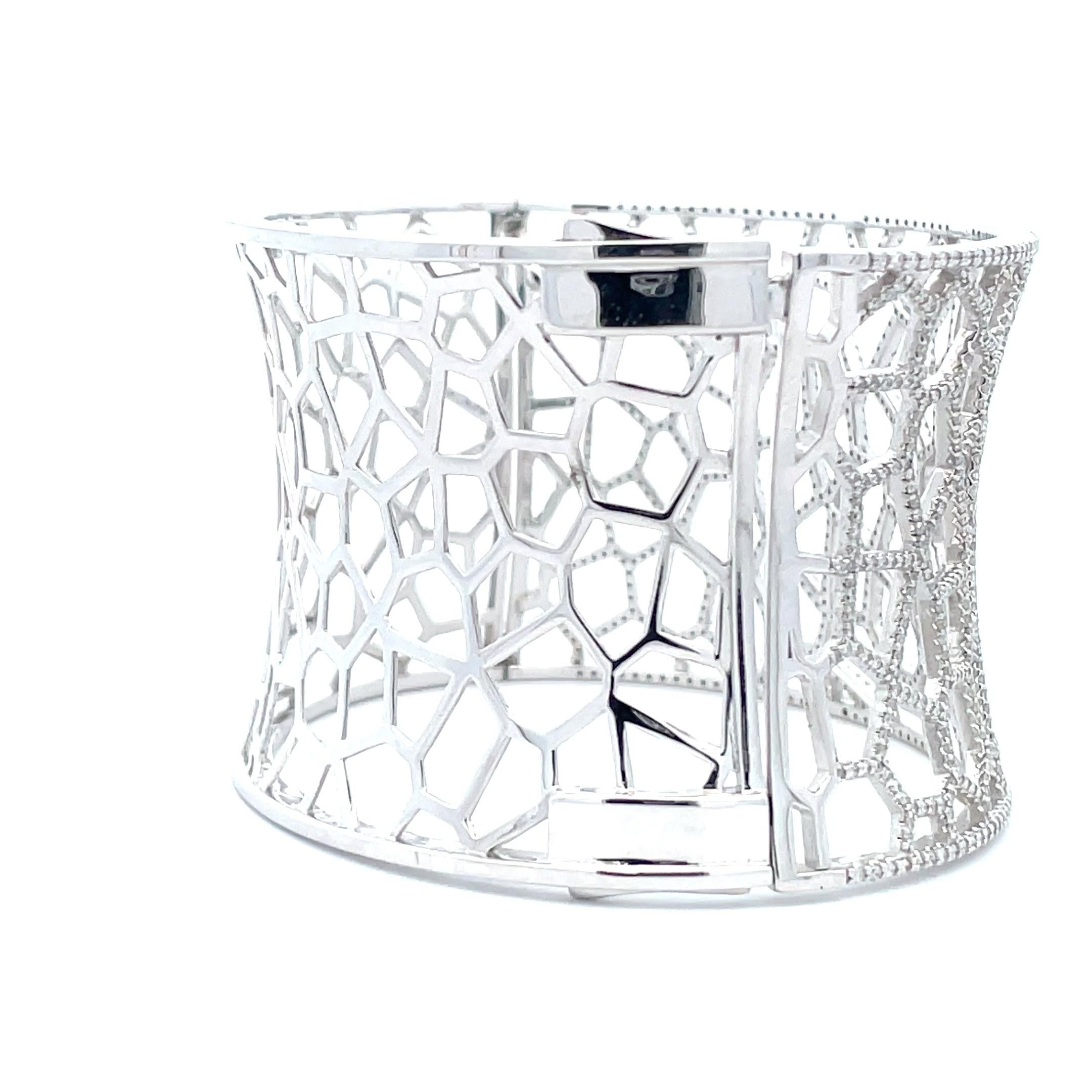 Bringing elegance and refinement to the everyday, this vintage-inspired bangle is handcrafted by a professional artisan with 14K White Gold. A brilliant 3.06 ct. diamond is set into a classic diamond web design, delivering captivating sparkle with