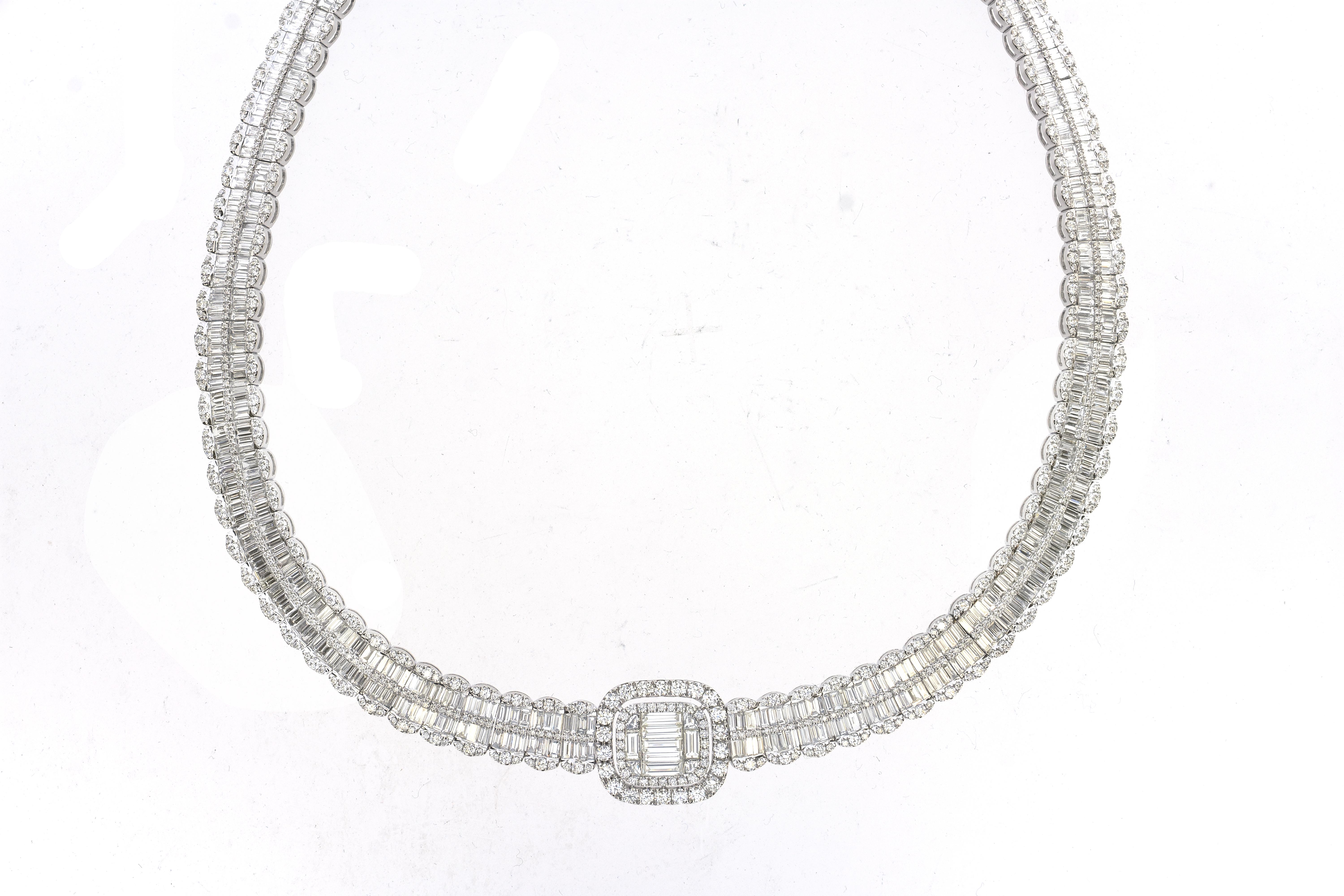 This exquisite and classy 30.68 Carat Baguette Diamond Necklace features 21.69 Carats of the finest cut Baguette White Diamonds and 8.99 Carats of Round White Diamonds. The Diamond Quality is all SI1 in Clarity and G-H in Color. This magnificent