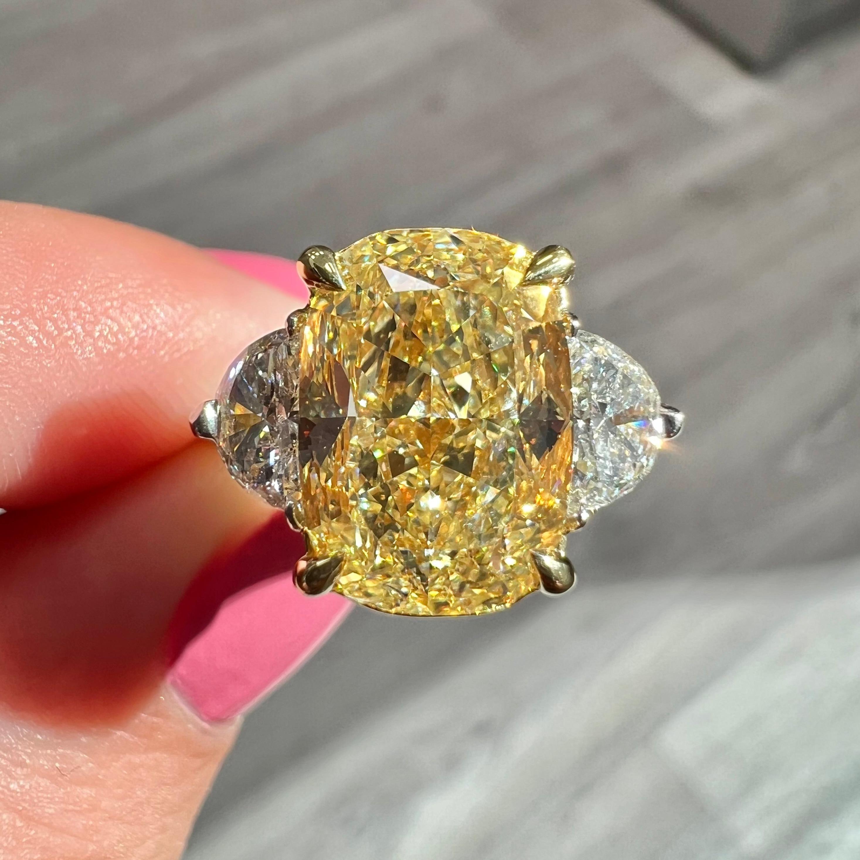 Top stone that will stand out among other Fancy Yellows
Full of life and 10/10 lemon yellow color
Set in Platinum and 18kt Yellow Gold with 0.33ct F VS Half Moons
100% eye clean and no negative effect from the Fluorescence 

Making Extraordinary