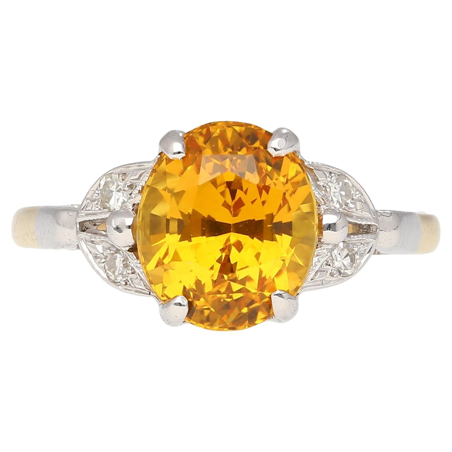 3.06 Ct Oval Yellow Sapphire with Diamonds Sides Ring in Platinum and 14k Gold For Sale