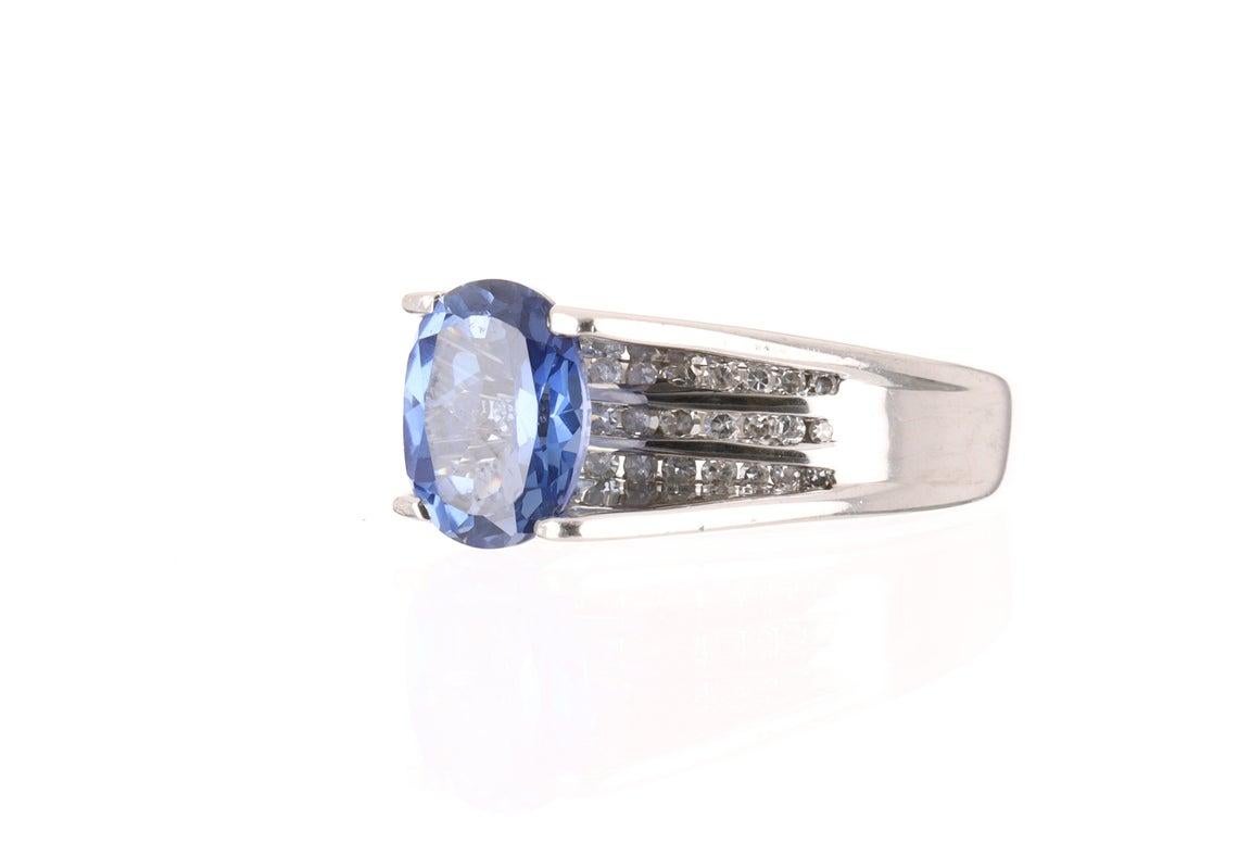 Showcased is a stunning tanzanite and diamond pave cocktail ring that is full of life and glamor from any angle. The beautiful center stone is safely placed in a four prong white gold setting. The natural tanzanite has a lovely bluish lavender color