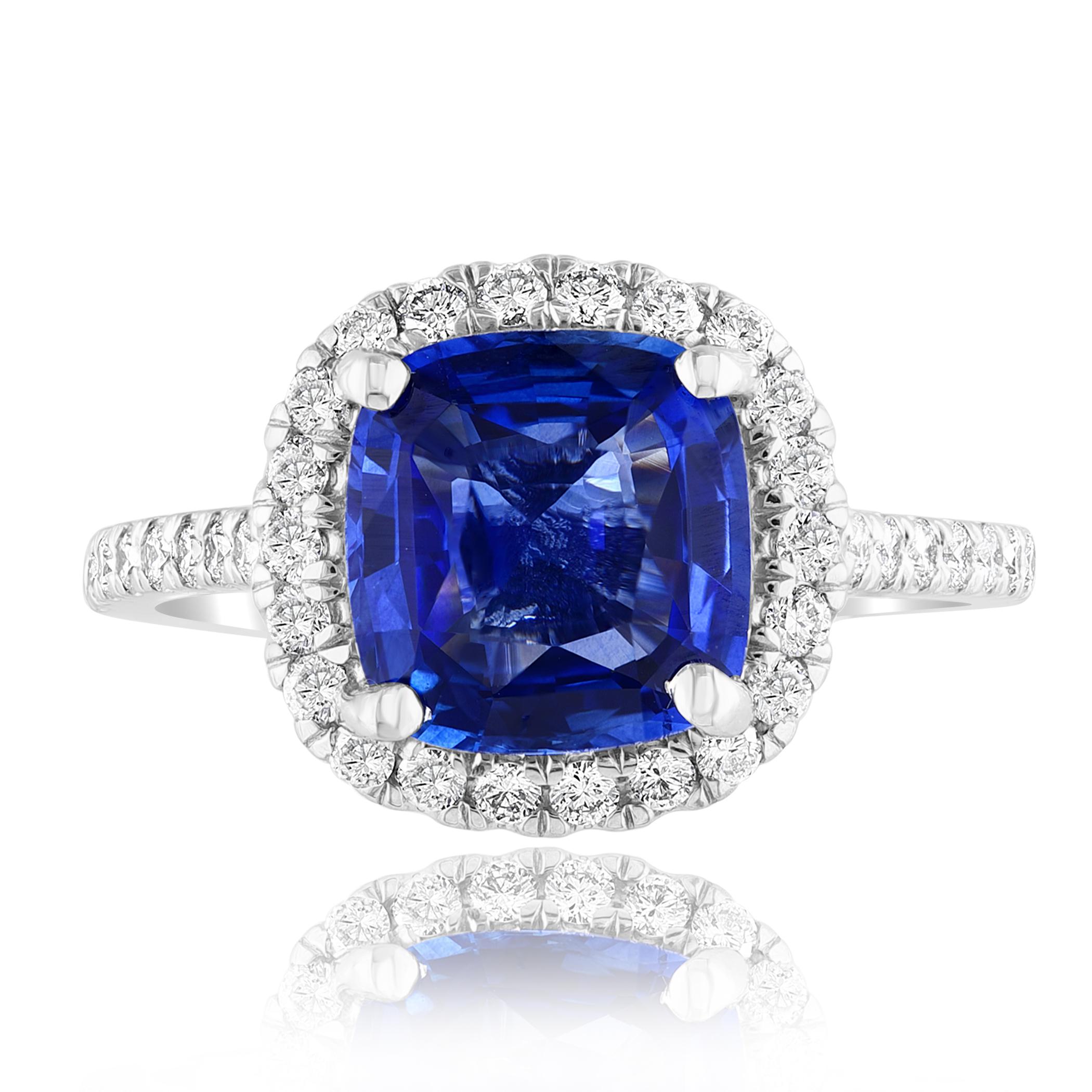 A simple classic ring showcasing a vibrant 3.07-carat cushion cut blue sapphire, surrounded by 
0.50 carats of 40 accent round diamonds. Made in Platinum.

Style is available in different price ranges. Prices are based on your selection of the 4C’s