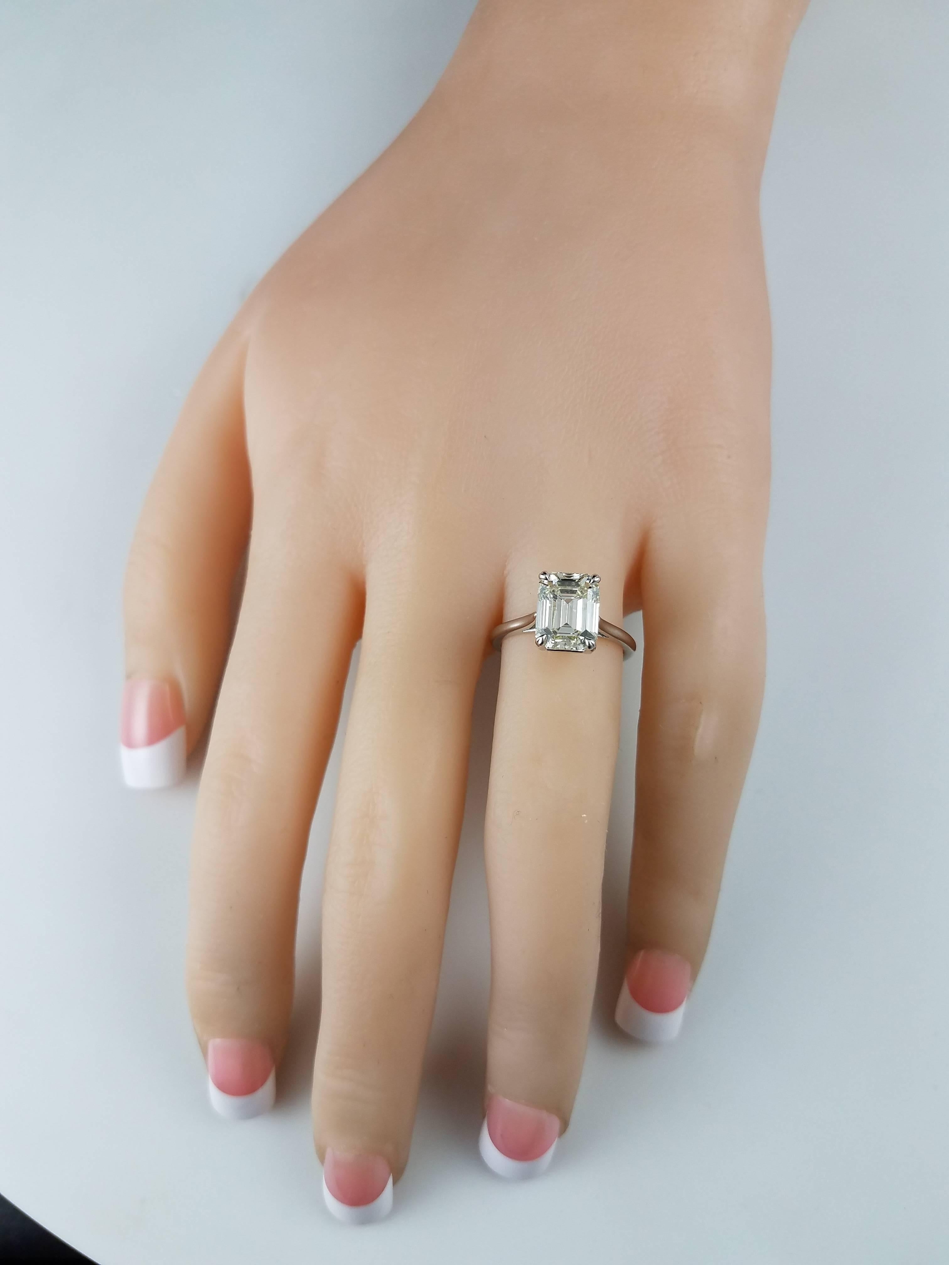 A timeless classic. A simple  engagement ring elegantly set with a 3.07 carat emerald cut diamond set in a thin, rounded, platinum shank. Size 4.5 US (sizable upon request). 1.44 millimeter shank.

Style available in different price ranges. Prices