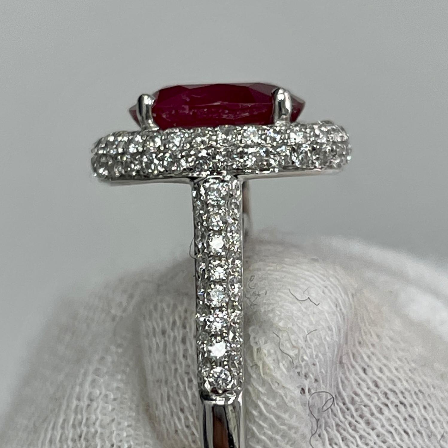 This saturated, stop sign red, no heat ruby is mounted in an elegant 18K white gold ring with 0.84 carats of brilliant white diamonds.