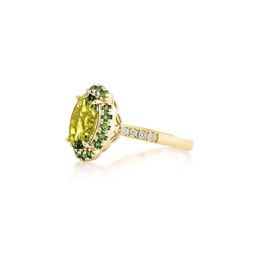 Oval Cut 3.07 Carat Peridot Fancy Ring in 18KYG with Tsavorite and White Diamond.   For Sale