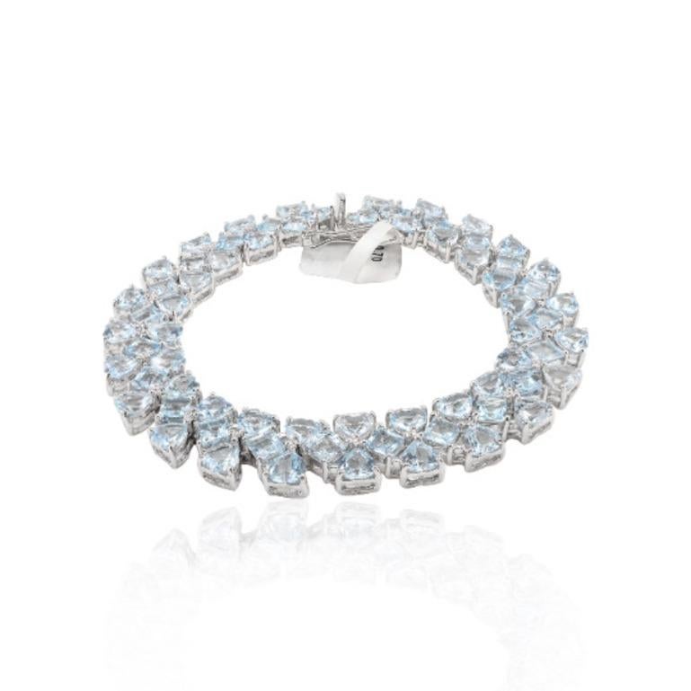 30.7 Carats Aquamarine Wide Bracelet in sterling silver showcases endlessly sparkling natural aquamrine, weighing 30.7 carat. It measures 7 inches long in length. 
Aquamrine stimulate concentration and reduces stress. 
Designed with perfect heart,
