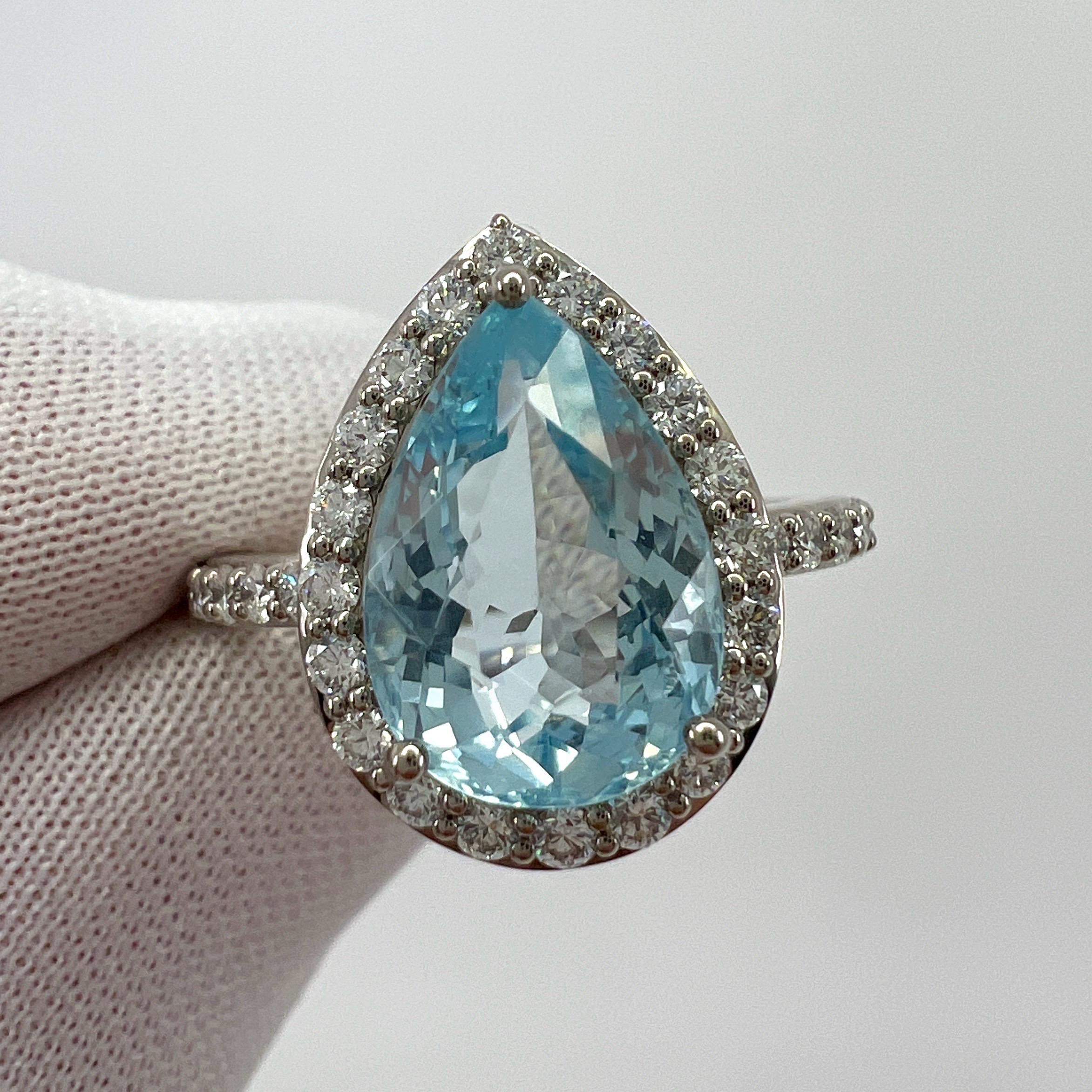 Fine Blue Aquamarine & Diamond 18k White Gold Pear Cut Cluster Halo Ring.

Stunning 18k white gold ring with a beautiful fine blue aquamarine weighing 3.07 carat.
A top grade aquamarine with an excellent pear cut and beautiful bright blue colour. 