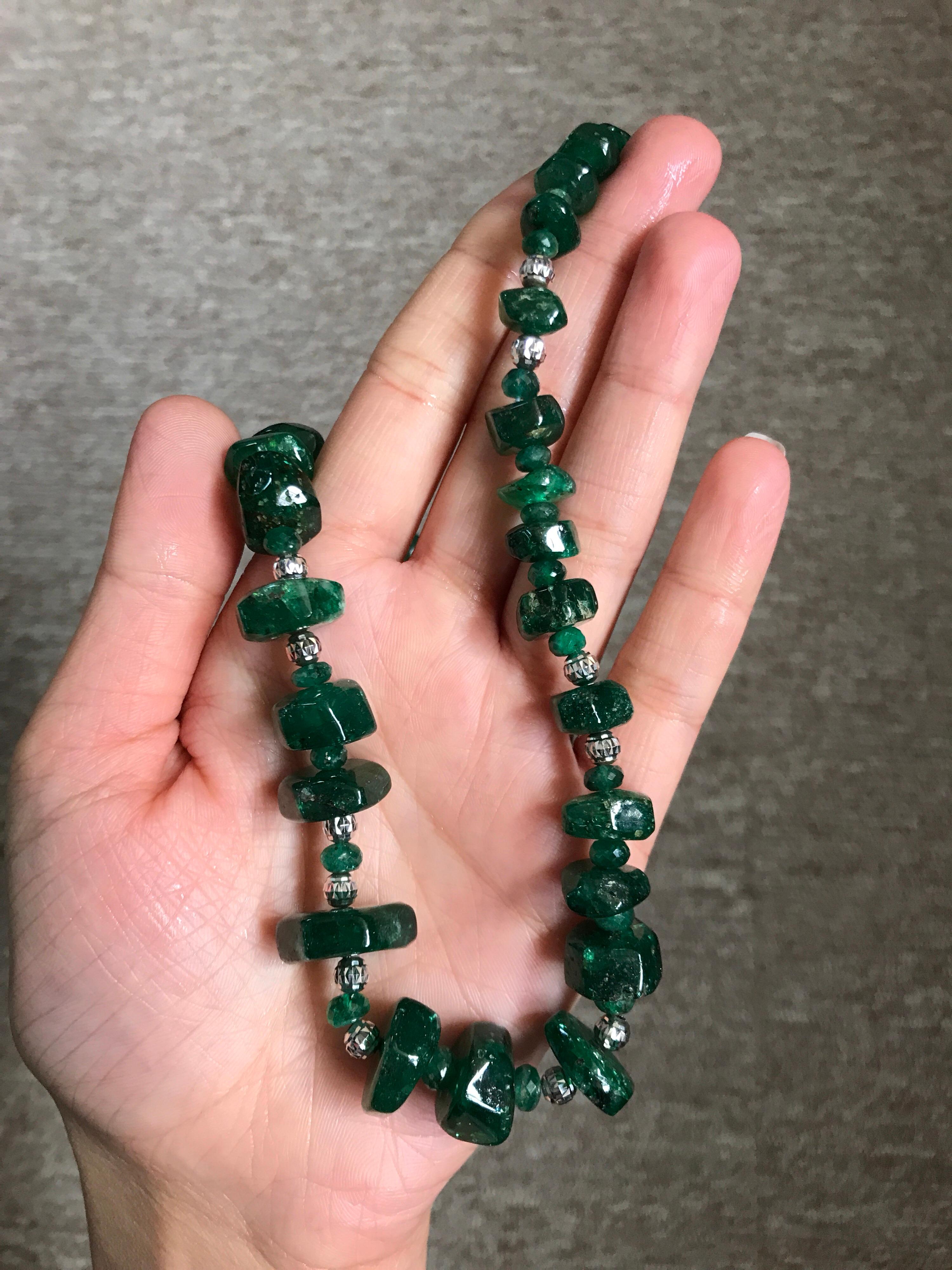 A very unique art-deco looking 308 carat, graduating size Emerald tumble beads necklace with 18K gold beads dividers and clasp. This necklace is one of a kind as it's rare to find this shaped emerald beads of this size which can be worn casually and