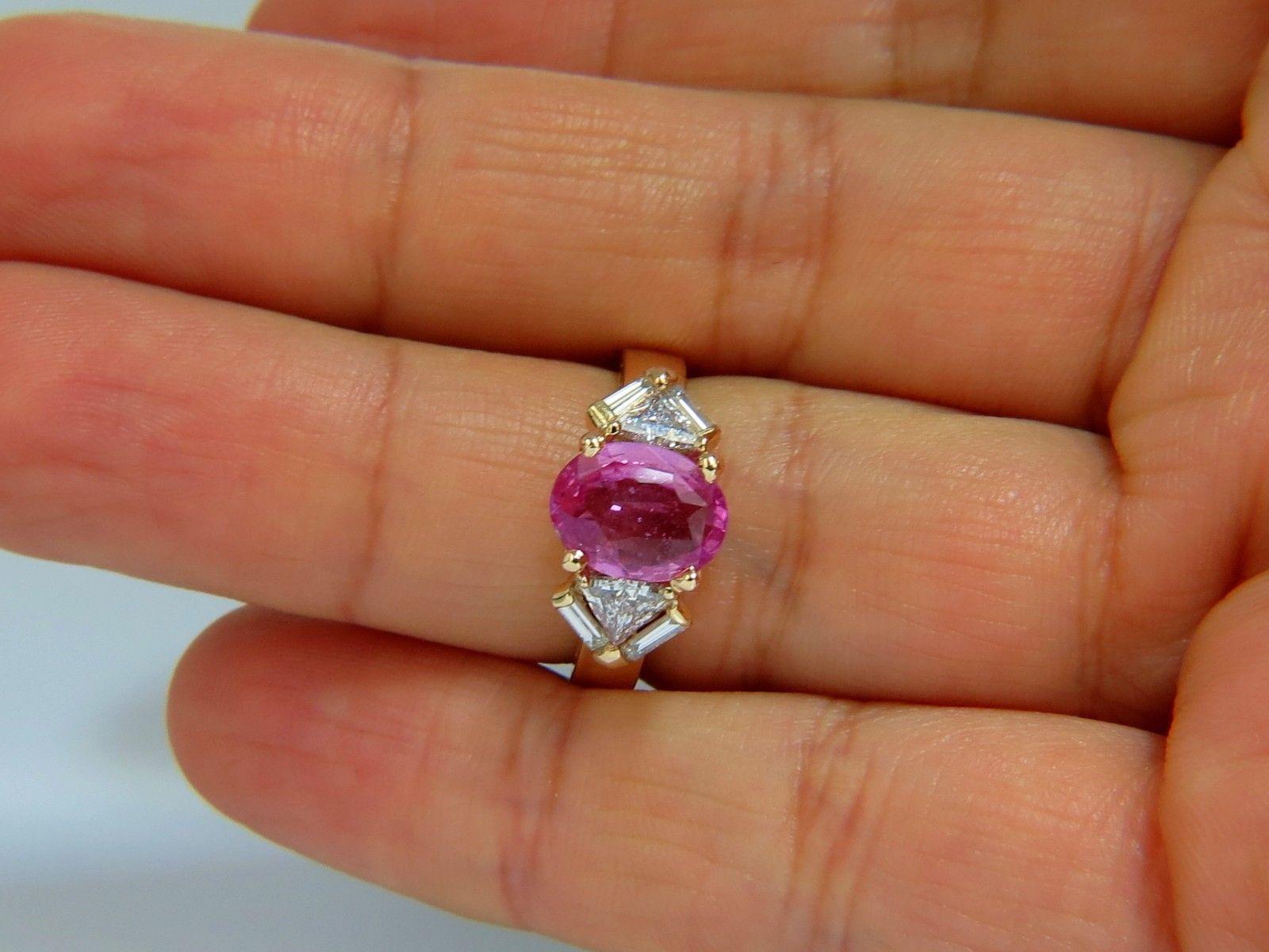 Pink Sapphire & Trilliants

2.20ct. Natural Pink sapphire ring.

Vivid pink color

Clean, Si-1 clarity.

Oval full cut

9.7 X 7.4mm

Transparent, Vibrant Pink color



.88ct. Side natural Trilliant & Baguette diamonds: 

G-color, Vs-2