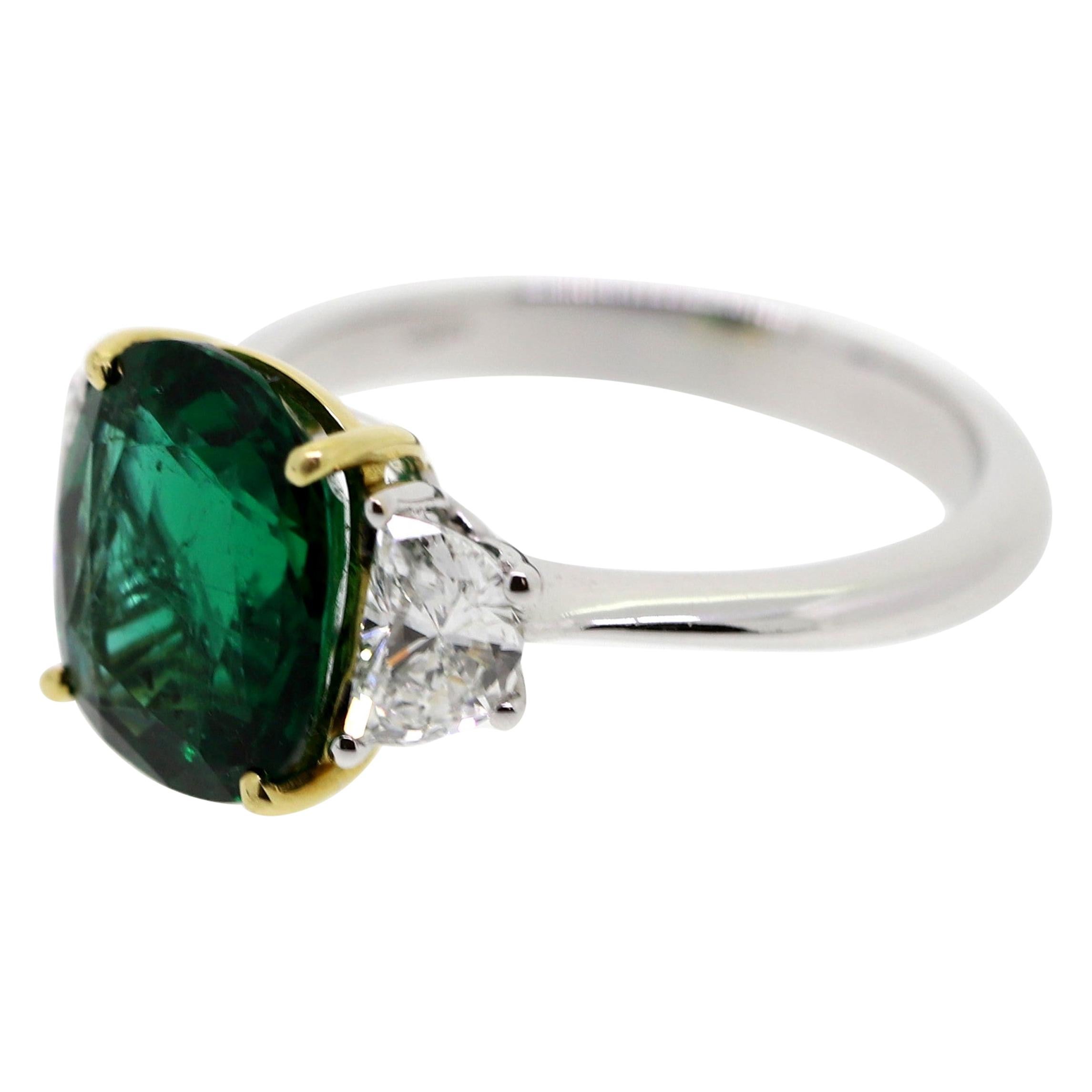 3.08 Carat Oval Emerald and 2 Half-Moon Natural White Diamonds Cocktail Ring For Sale