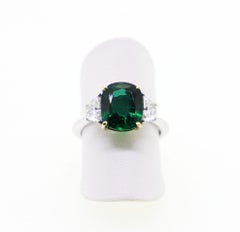 3.08 Carat Oval Emerald and 2 Half-Moon Natural White Diamonds Cocktail Ring