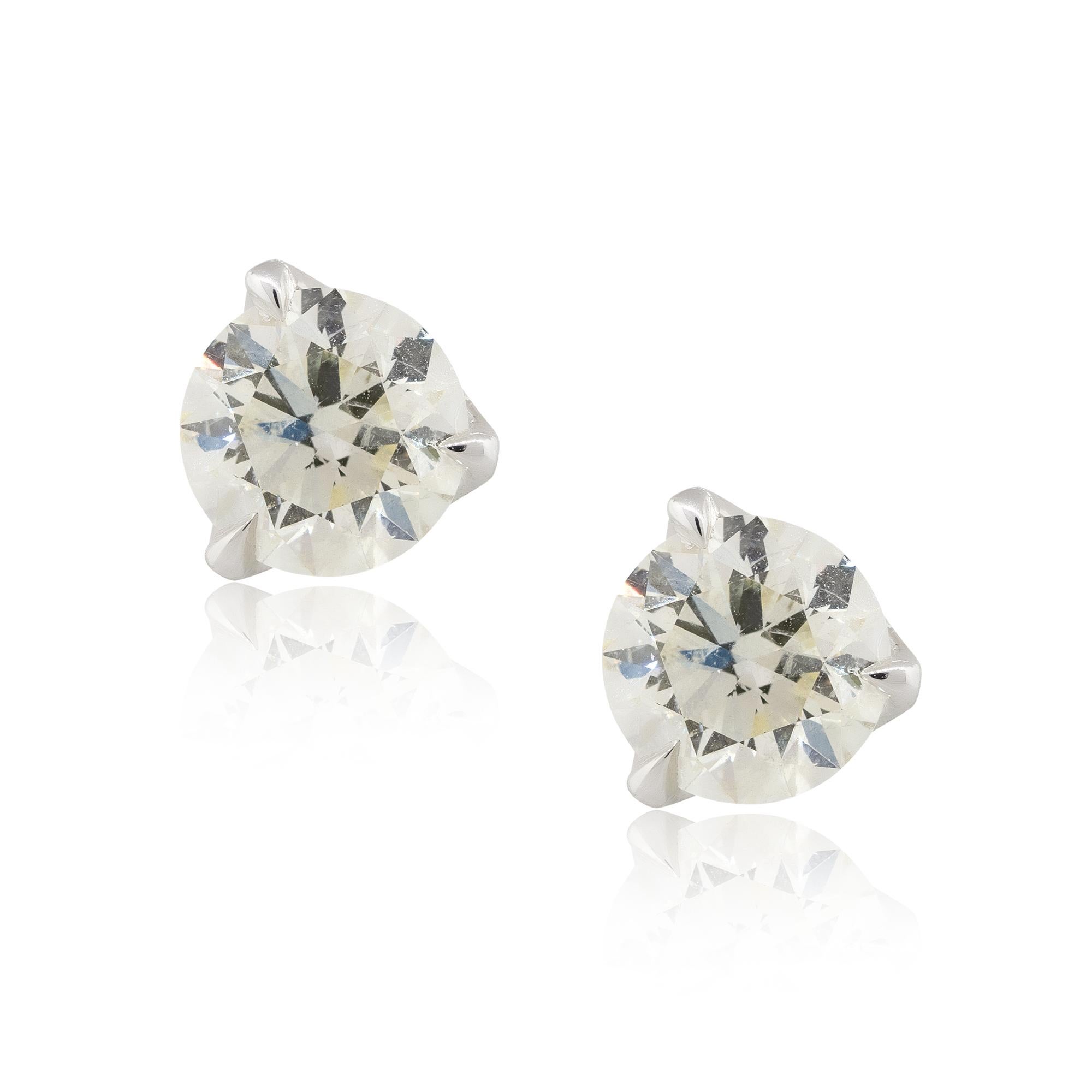 Material: 18k White Gold
Diamond Details: Approx. 3.08ctw of round cut Diamonds. Diamonds are G/H in color and VS in clarity
Measurements: 16.5mm x 8.30mm
Earrings Backs: Tension post
Total Weight: 2.1g (1.3dwt) 
Additional Details: This item comes