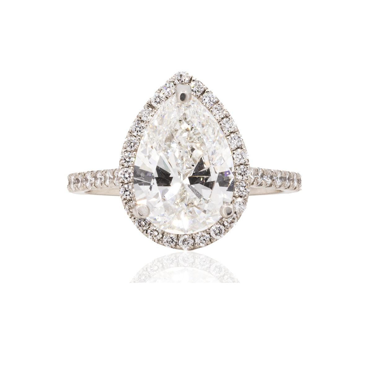 Platinum Ring with GIA certified (#2231298393) 3.08 carat, G color, VS1 clarity pear shape diamond and 42 round brilliant diamonds weighing 0.64 carats. 5.76 grams