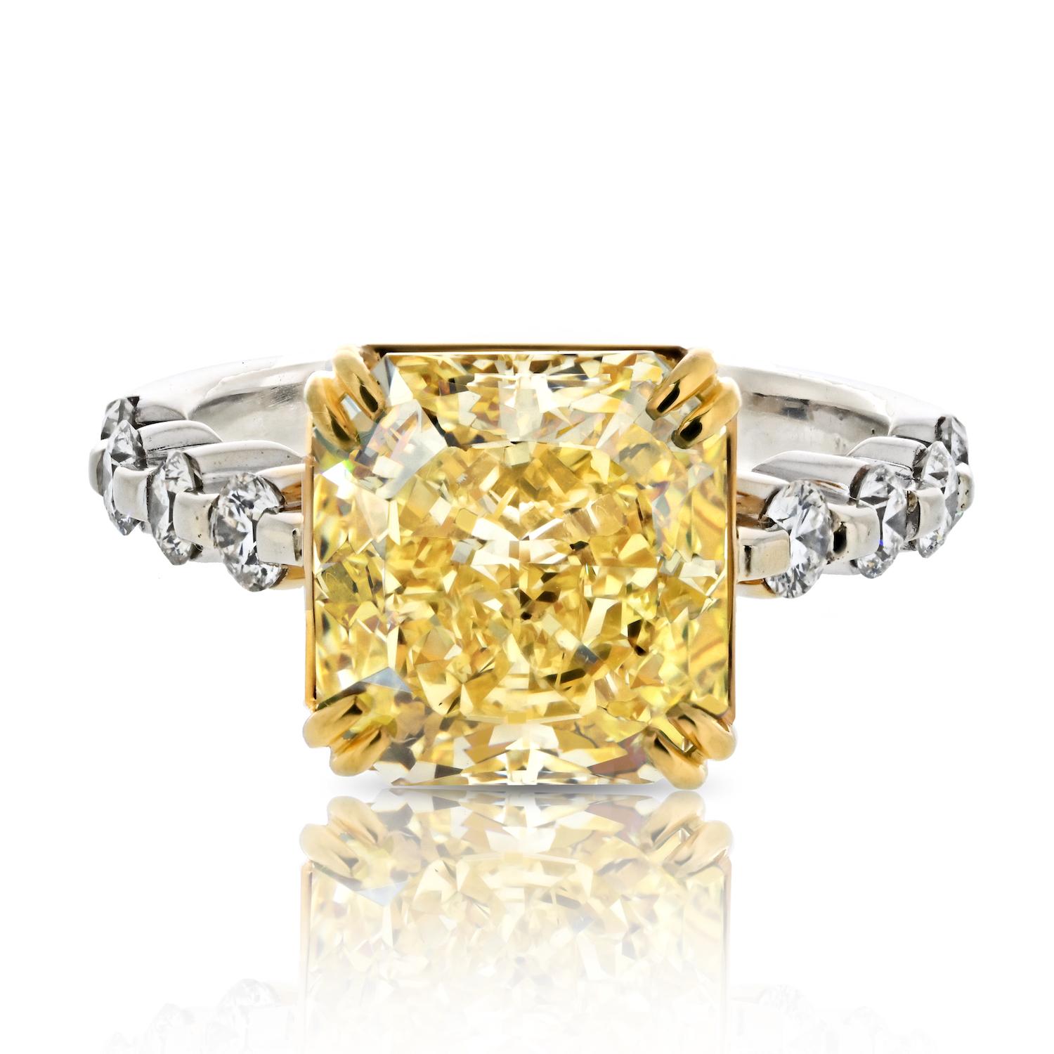 Elevate your love story with this mesmerizing 3.62-carat Radiant Cut Diamond Fancy Intense Yellow GIA-certified engagement ring. The center diamond, a dazzling focal point, boasts a rare Fancy Intense Yellow hue that exudes warmth and vibrancy. What