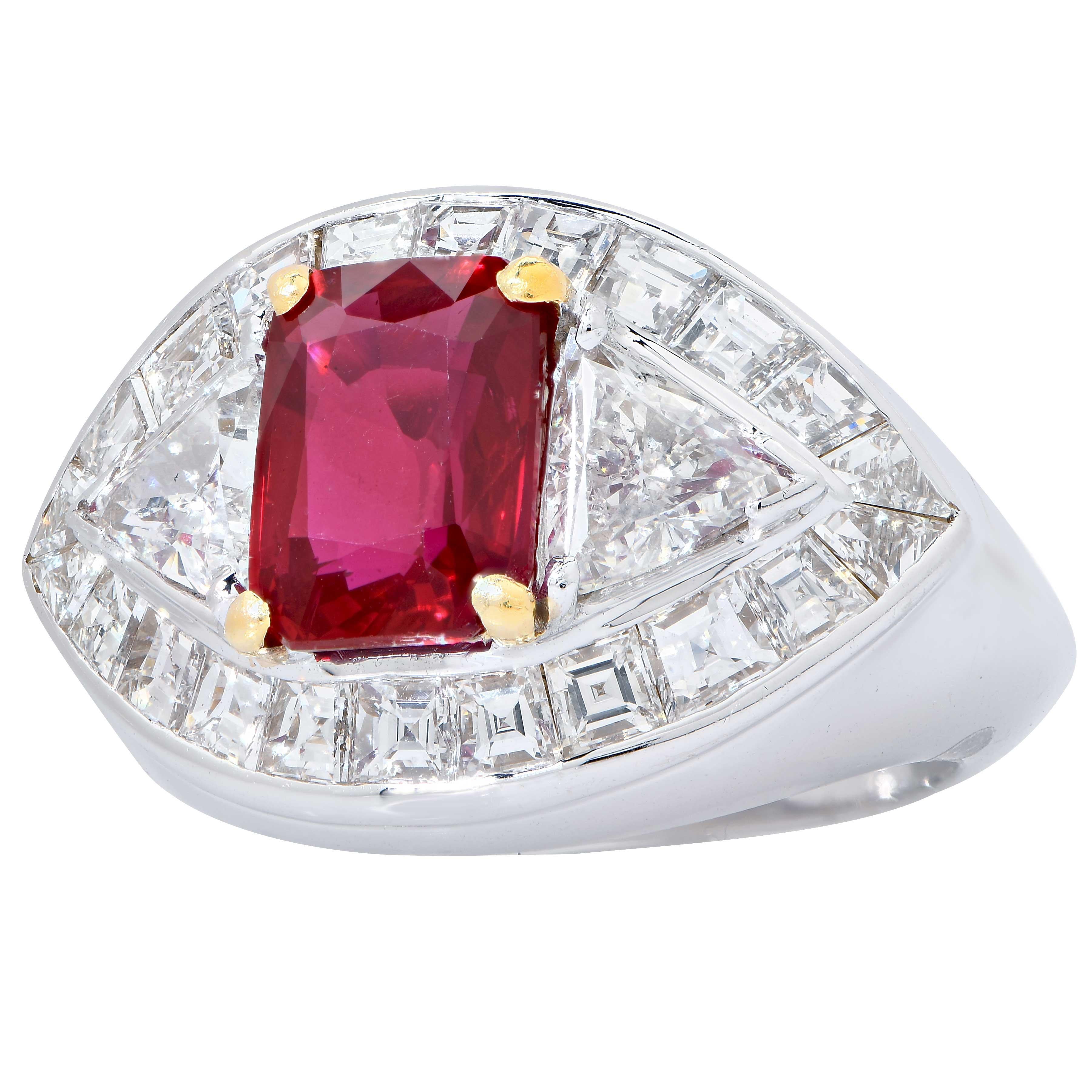 18 Karat White Gold Ruby and Diamond Cocktail Ring Featuring a Navette Shaped Panel Center Set with An Emerald Shaped Mix Cut Ruby Weighing 3.09 Carats Accompanied By An American Gemological Laboratory (AGL) Colored Stone Origin Report Dated 24