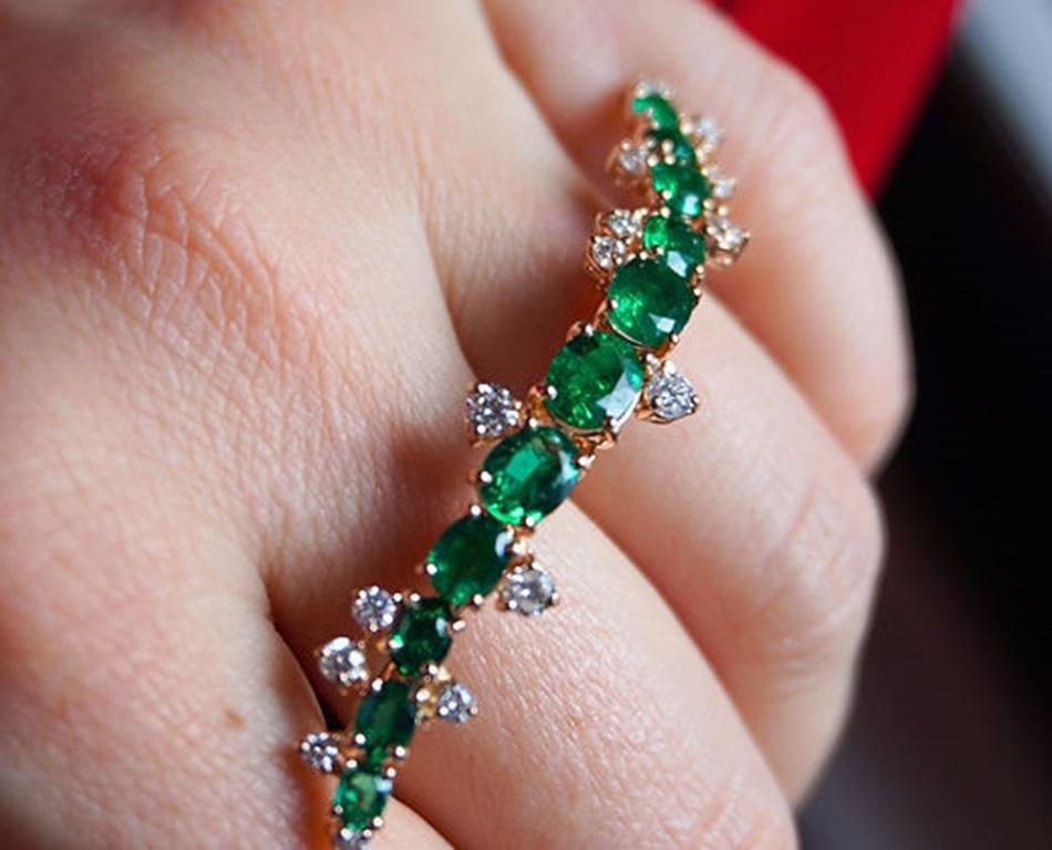 Emerald Weight: 3.09 CT, Diamond Weight: 0.70 CT, Metal: 18K Rose Gold/9.74 gm, Ring Size: 6 - 8.5, Shape: Oval, Color: Green, Hardness: 7.5-8, Birthstone: May
