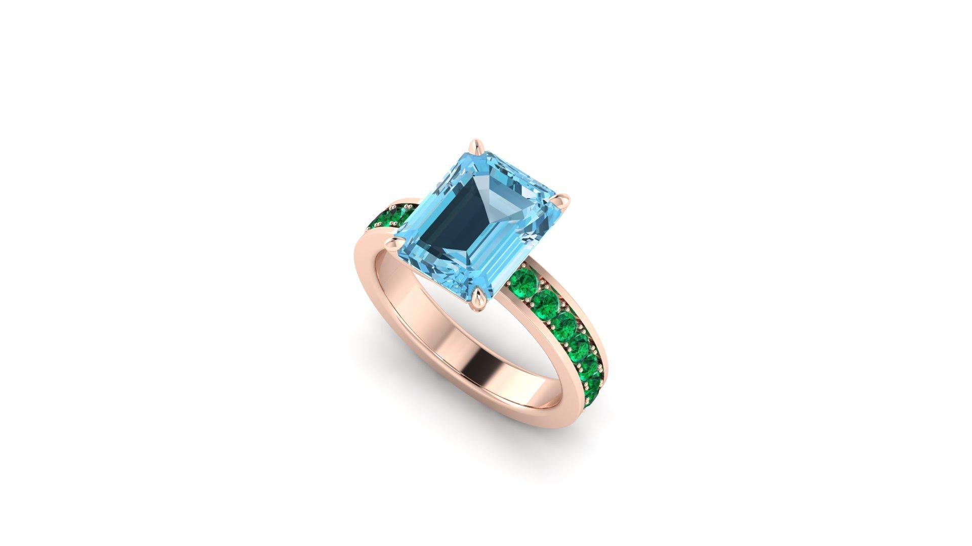 Natural Aquamarine 3.09 carats of intense blue, eye clean mineral, set in a 18k Rose gold custom made riing, showcasing a pave' half way down, of natural electric green Emeralds for an approximate total carat weight of 0.35 carats.
This ring is made