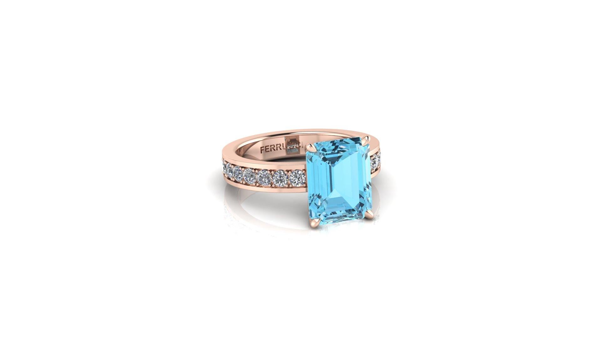 Natural Aquamarine 3.09 carats of intense blue, eye clean mineral, set in a 18k Rose gold custom made riing, showcasing a pave' half way down, of natural white Diamonds G/H color, VS clarity, for an approximate total carat weight of 0.35