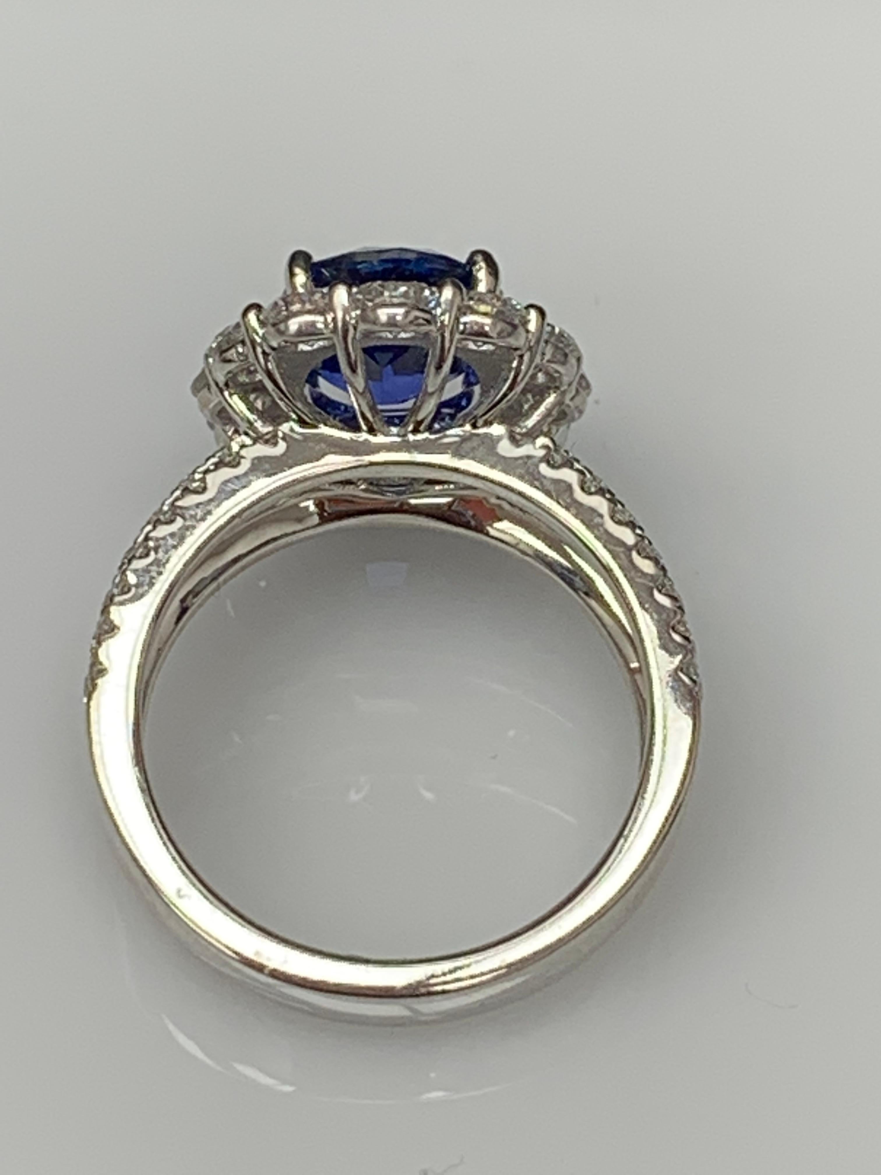 Contemporary 3.09 Carat Oval Shape Blue Sapphire and Diamond Flower Ring in 18K White Gold For Sale