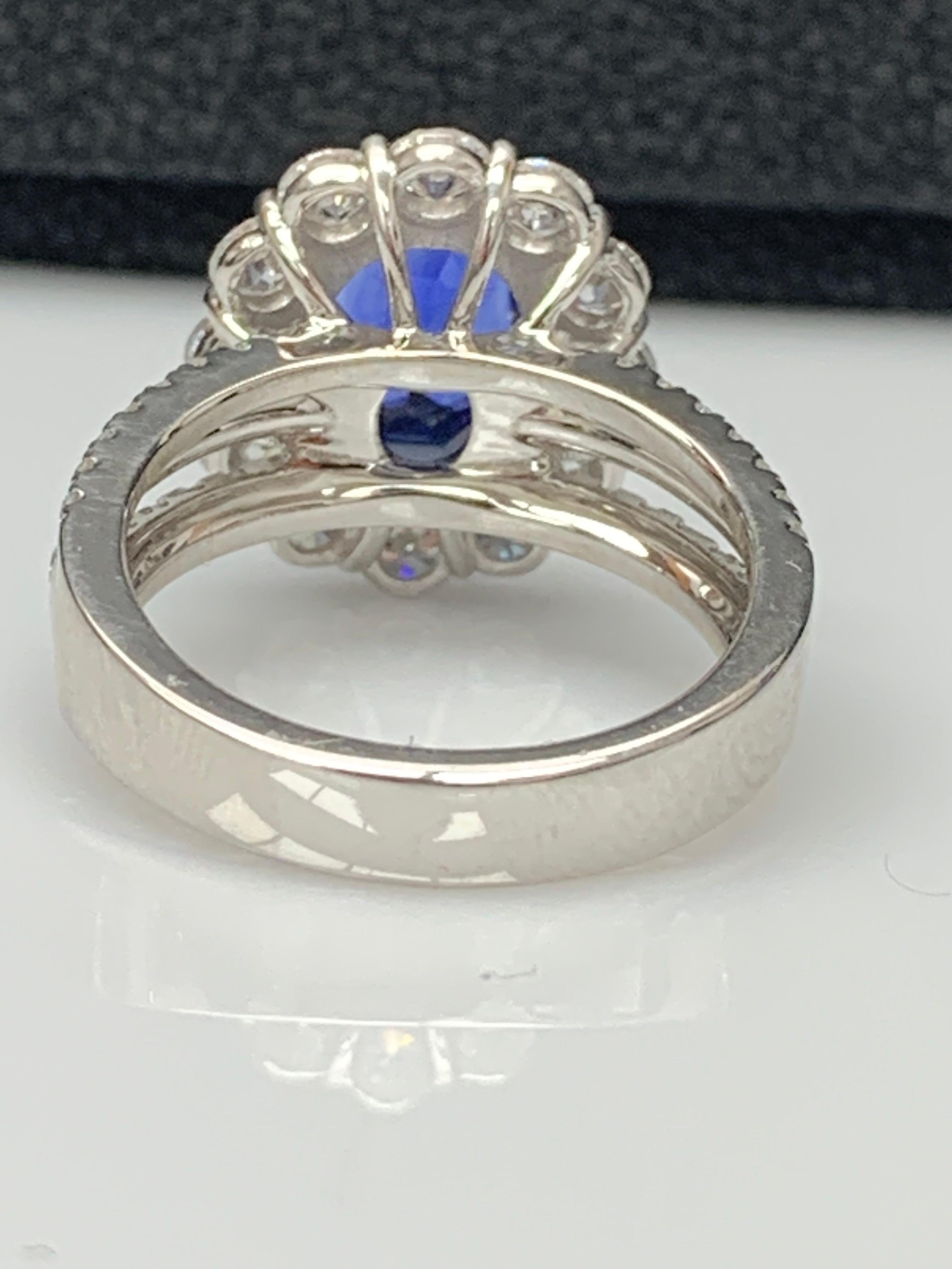 Oval Cut 3.09 Carat Oval Shape Blue Sapphire and Diamond Flower Ring in 18K White Gold For Sale