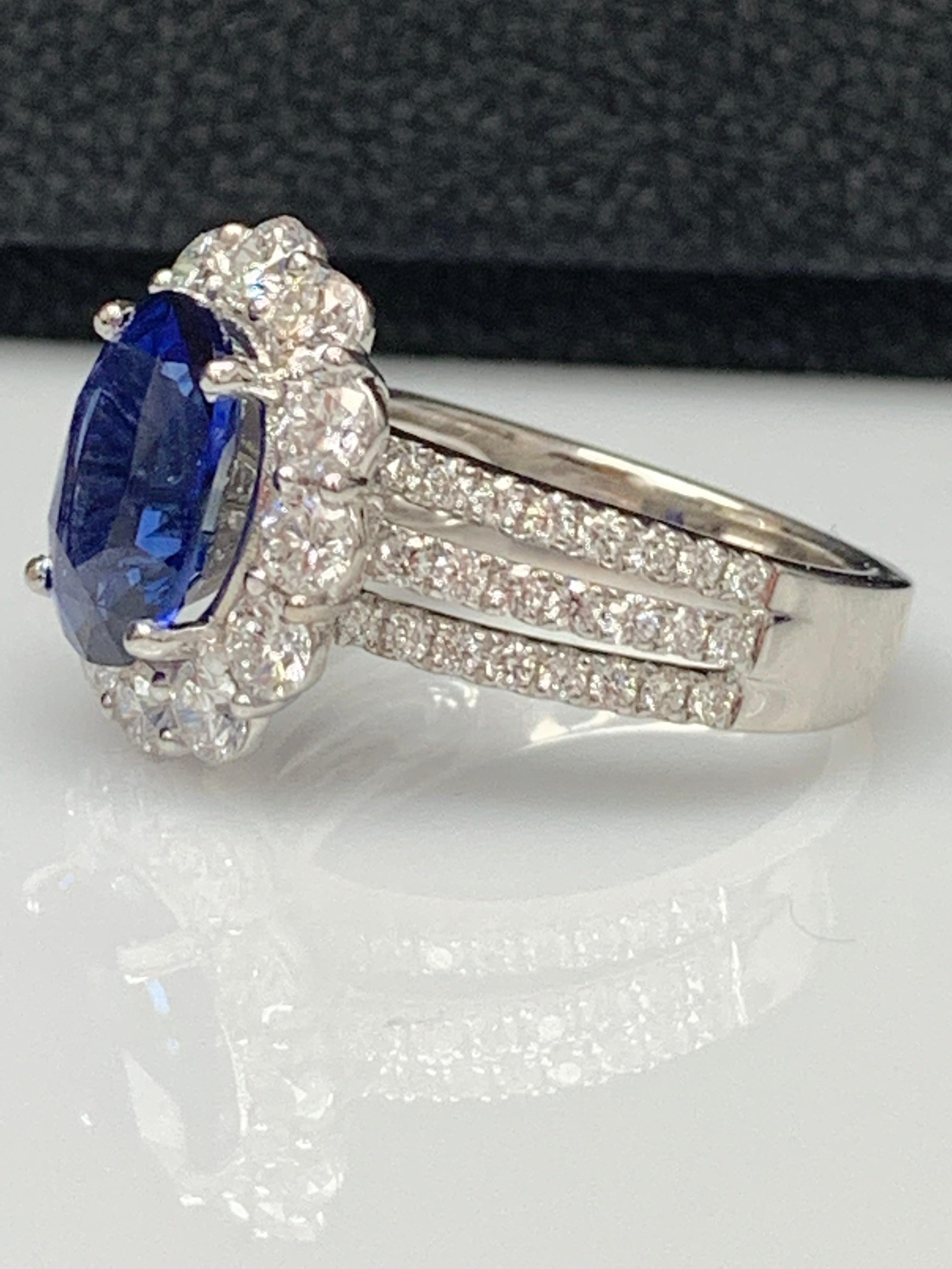 3.09 Carat Oval Shape Blue Sapphire and Diamond Flower Ring in 18K White Gold In New Condition For Sale In NEW YORK, NY