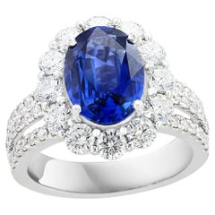 3.09 Carat Oval Shape Blue Sapphire and Diamond Flower Ring in 18K White Gold