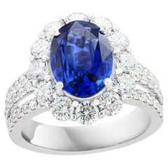 3.09 Carat Oval Shape Blue Sapphire and Diamond Flower Ring in 18K White Gold