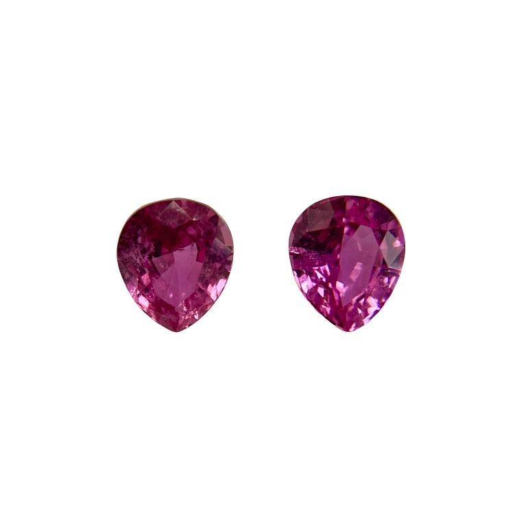 These dangling 18K white gold earrings carry 0.79Ct of brilliant white diamonds and 3.09Ct of stunning matching pear shape pink sapphires