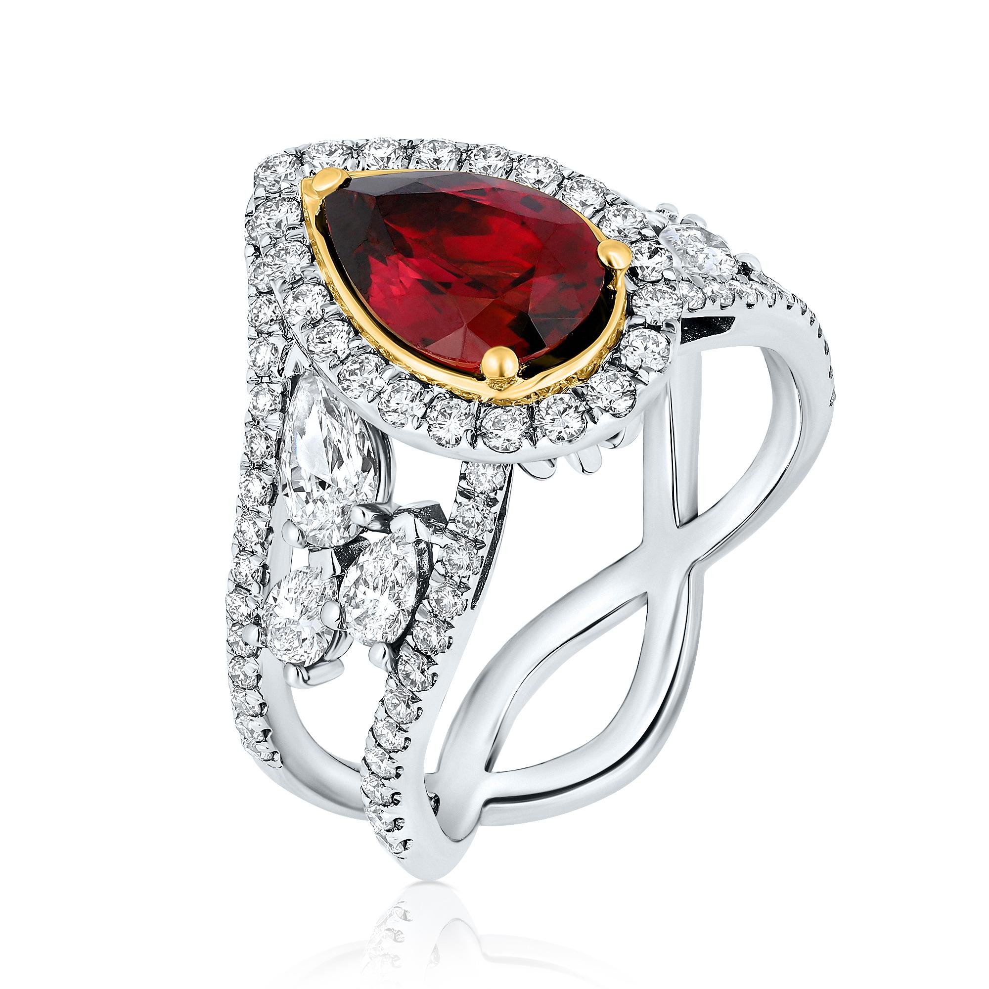 A gorgeous Cocktail ring Showcasing 1.71 Carat pear shaped Red Tourmaline (Rubellite). This exquisite centerpiece is elegantly complemented by a halo of round brilliant Diamonds, which enhance the visual impact of the central stone. To further
