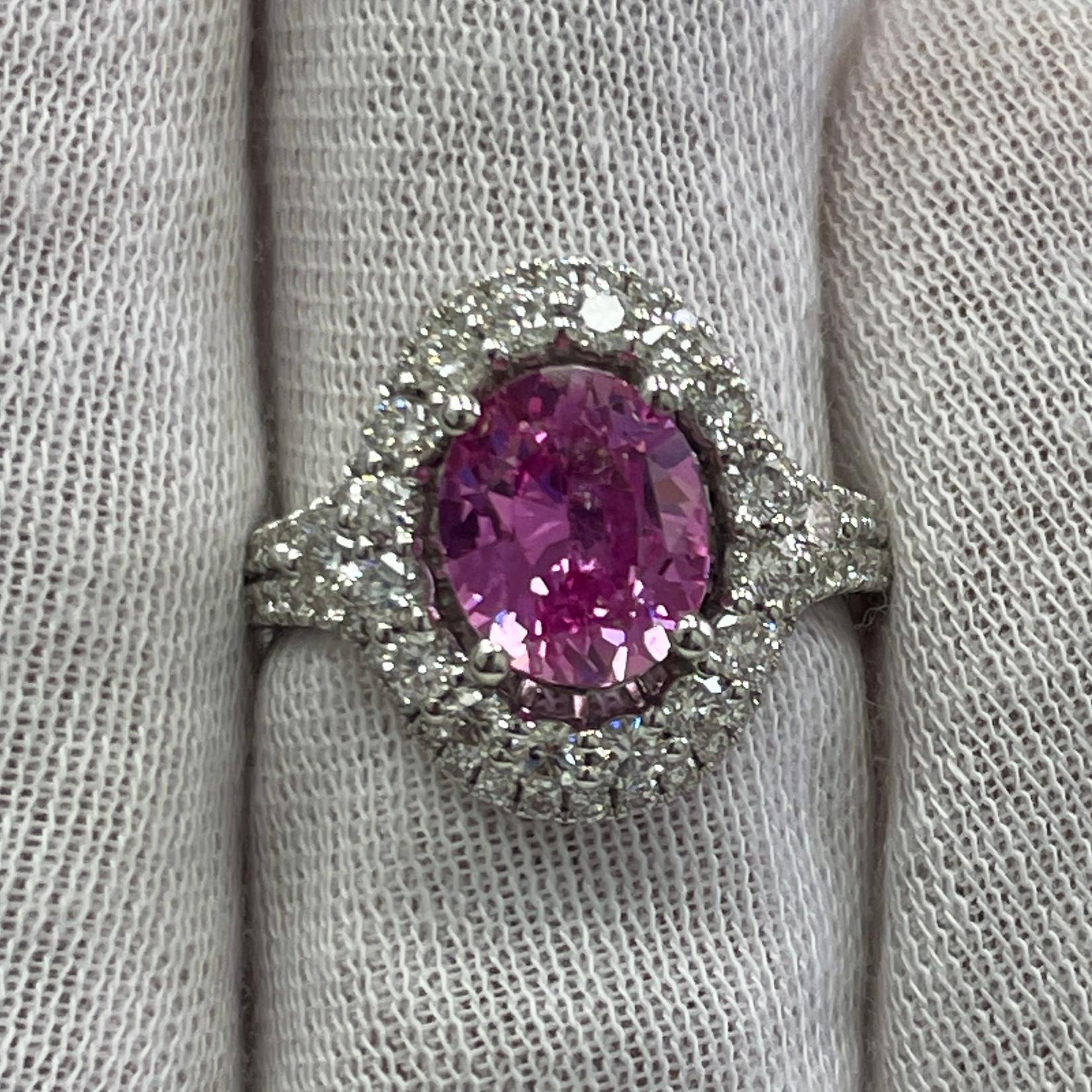 This is a BREATHTAKING pink sapphire with a bubble gum pink color, mounted in an elegant 18K white gold and diamond ring with 0.1.15Ct of brilliant white diamonds. Suitable for any occasion!