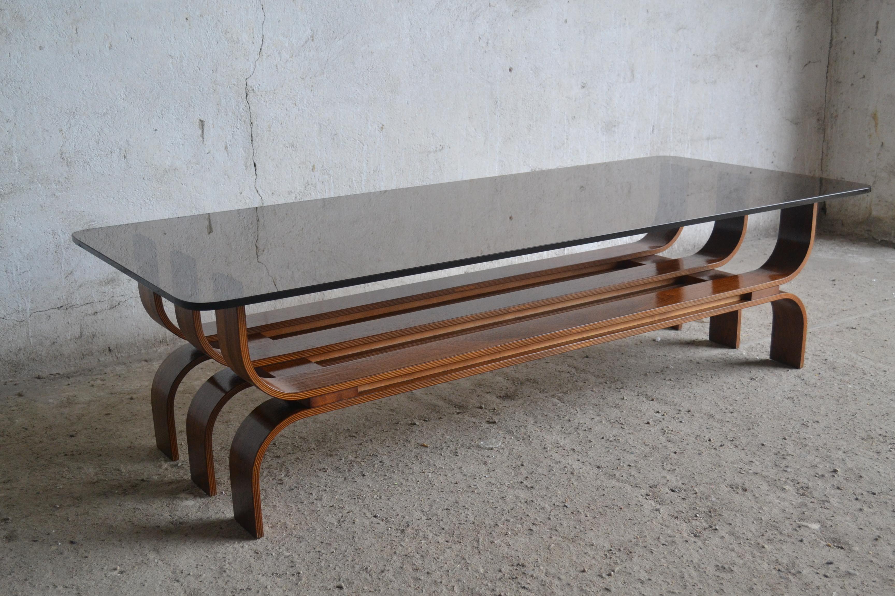 - Coffee table model 3092 
- Made of thick, bent plywood in rosewood veneer
- In original condition
- Weighs about 60 kg