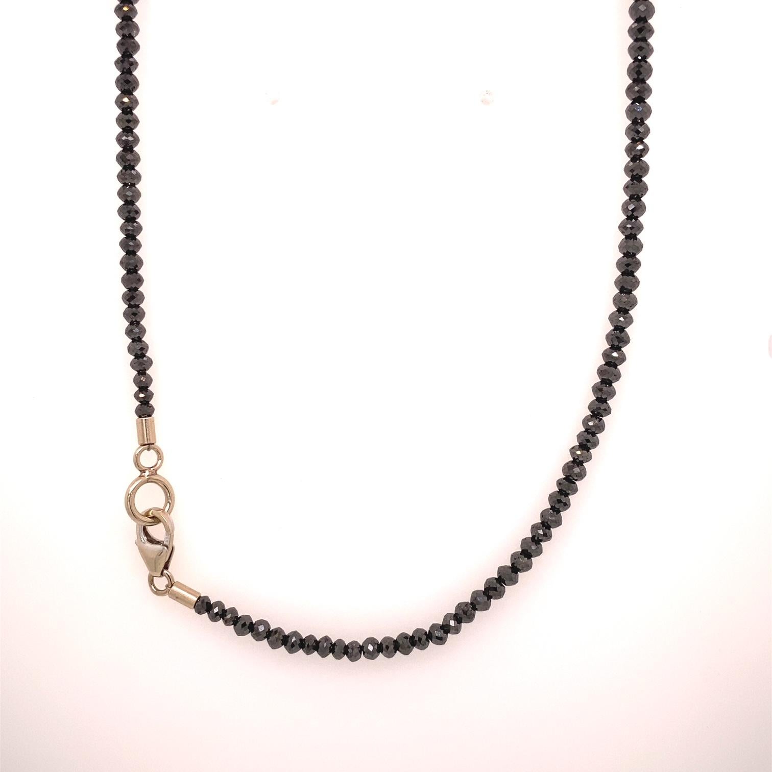 A 30.94 carat faceted black diamond necklace with a 14k white gold clasp. This necklace was made and designed by llyn strong.