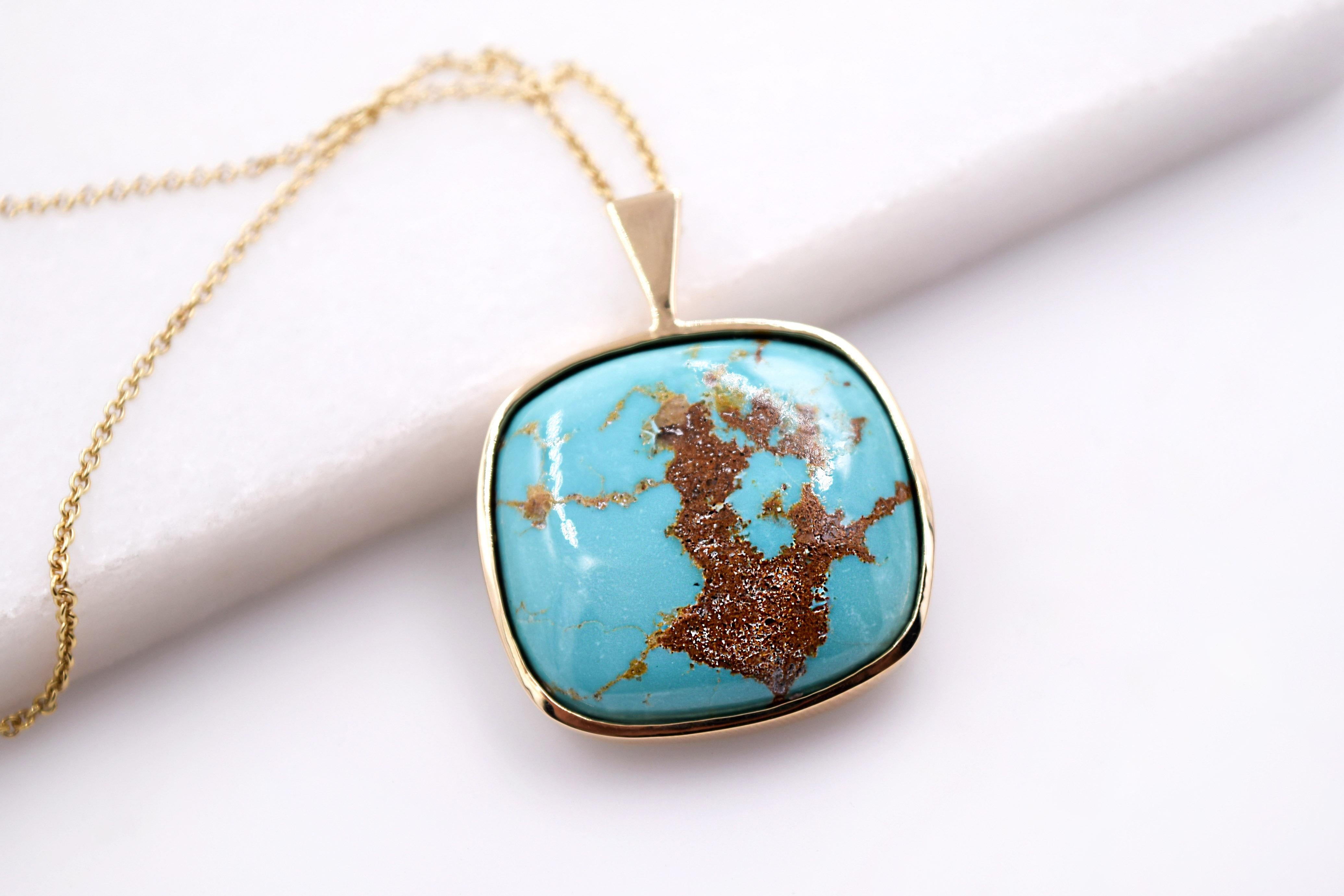 - Highly Collectible Morenci Turquoise Pendant 
- Cabochon Cut 
- Set in 14K High Polished Yellow Gold Bezel
- Hangs on an 18 Inch 14 Karat Yellow Gold Cable Chain 
- Chain can be requested in any length