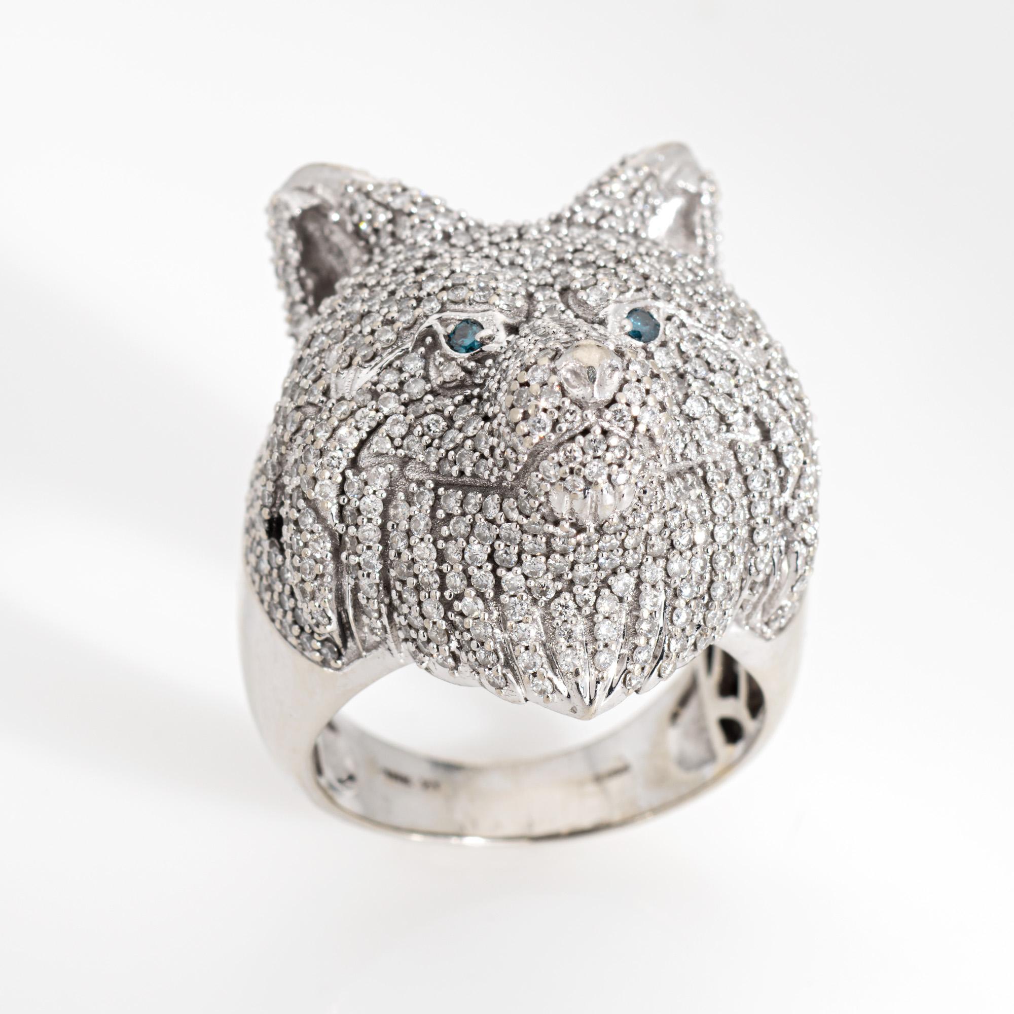 Bold and distinct pave diamond Bear ring crafted in 10 karat white gold. 

Pave set diamonds total 3.09 carats (estimated at H-I color and SI1-I2 clarity). Two blue diamonds (irritated) are set into the eyes. 

Bold and beautiful, the majestic beast