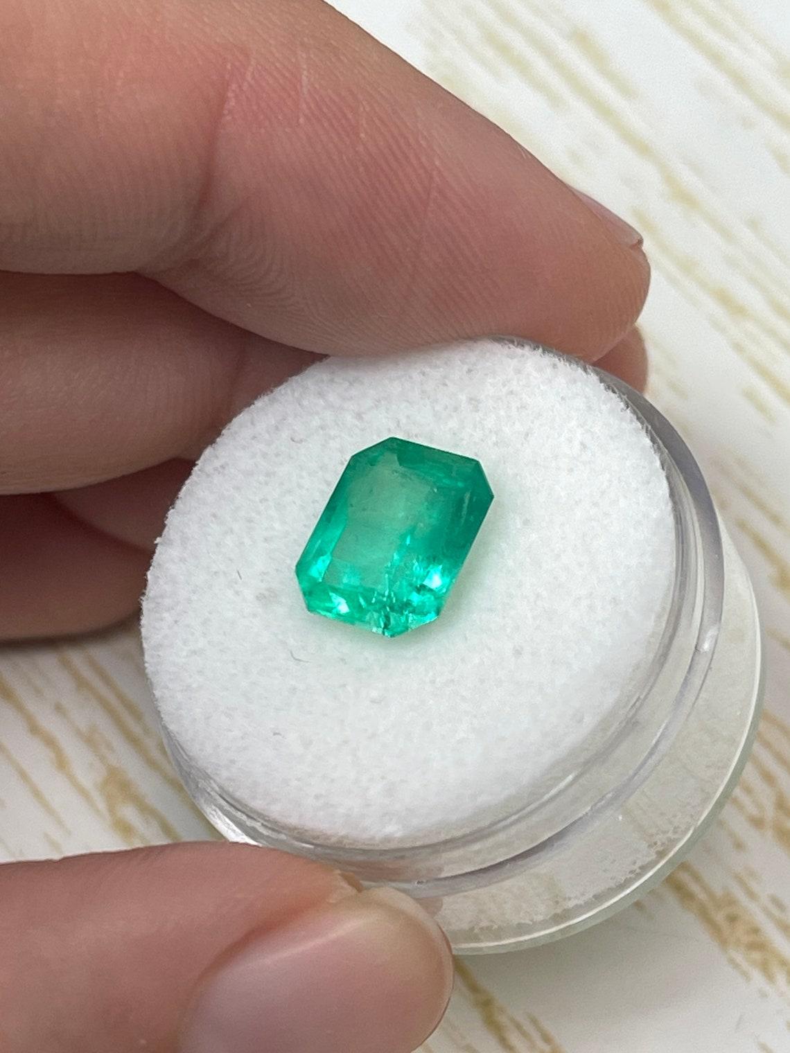 Modern 3.09ct Electric Yellowish Green Colombian Emerald 10x8mm Emerald Cut May For Sale