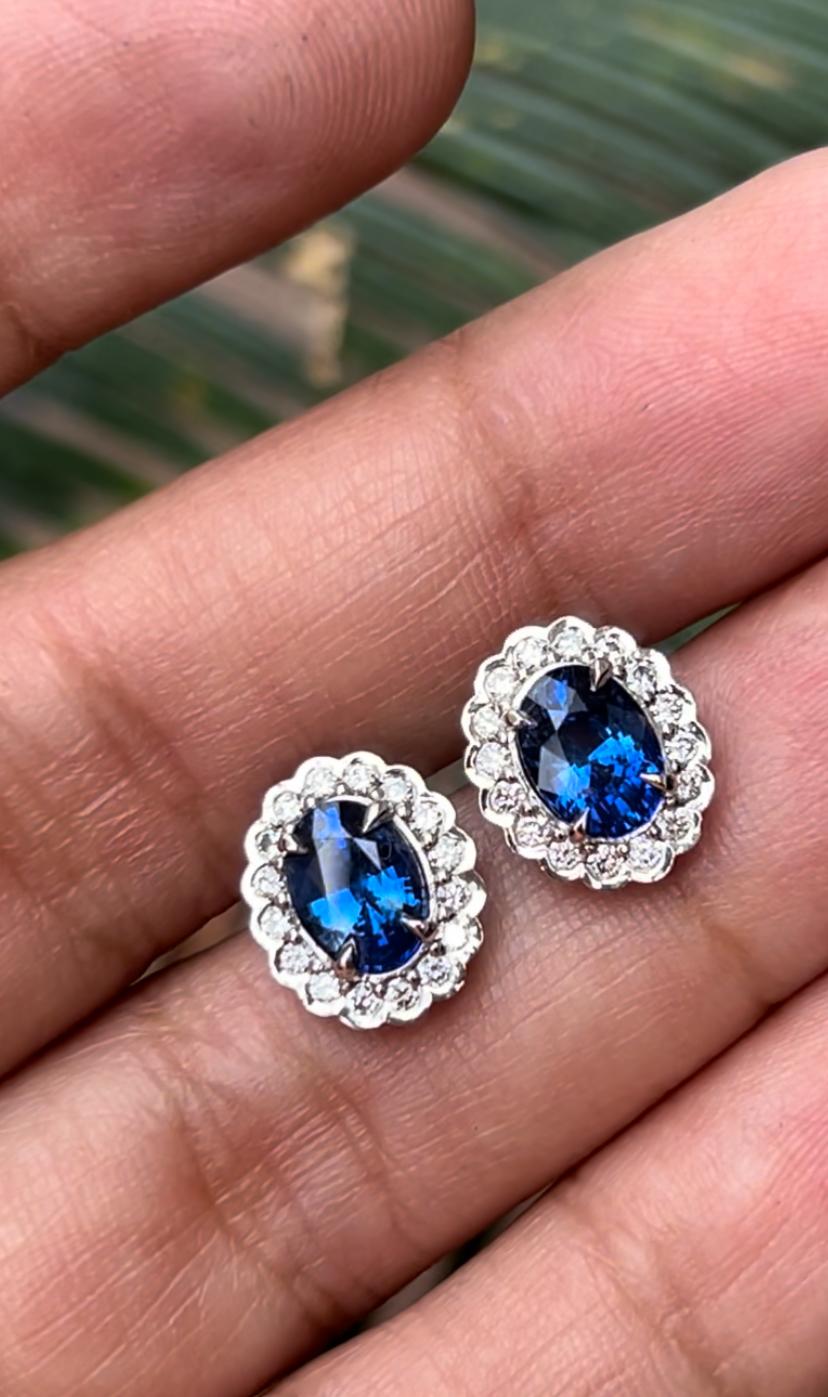 Contemporary 3.09ct GIA certified, Ceylon oval Blue Sapphire platinum earrings. For Sale