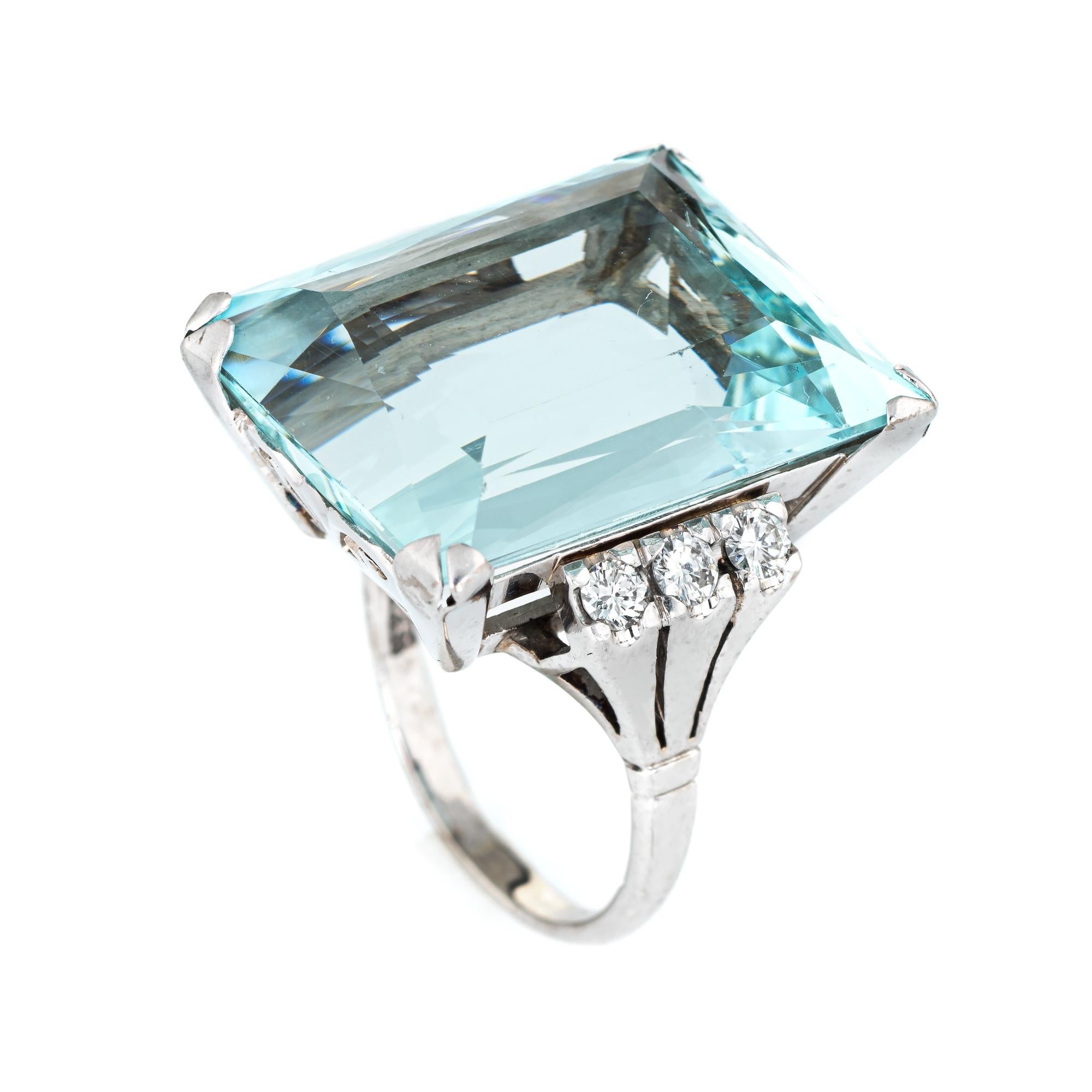 Stylish vintage aquamarine & diamond cocktail ring (circa 1950s to 1960s) crafted in 14 karat white gold. 

Faceted square cut aquamarine measures 22mm x 18.5mm (estimated at 30 carats) is accented with six estimated 0.05 carat round brilliant cut