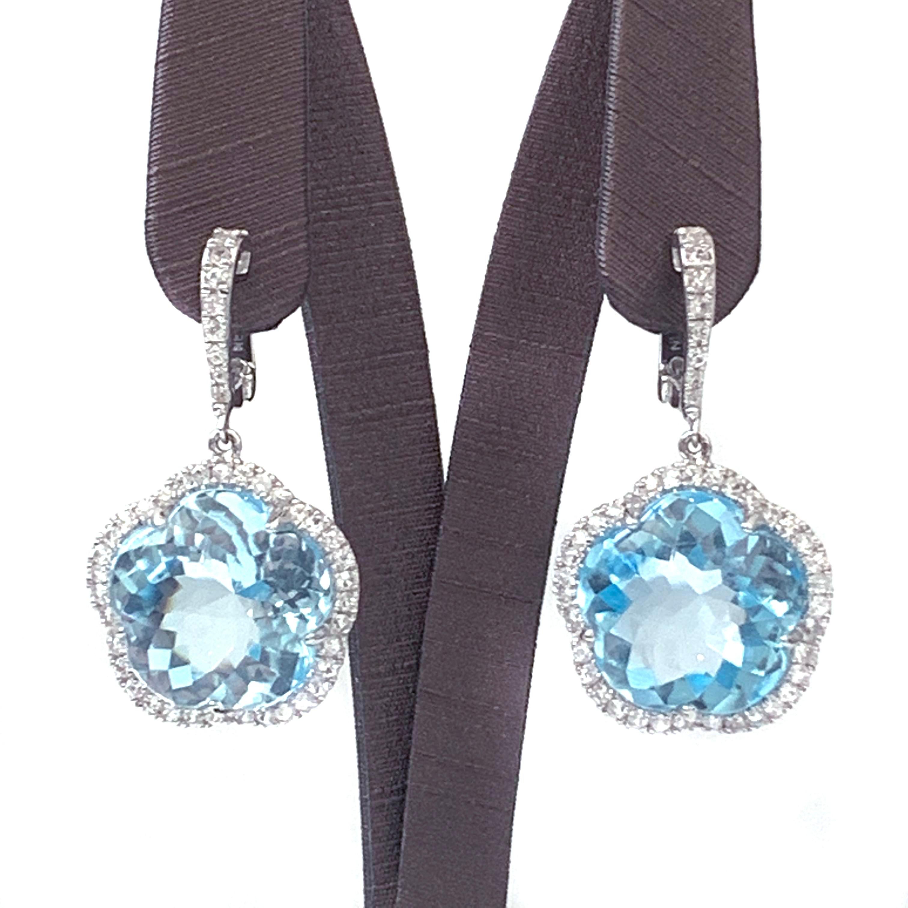 Stunning 30ct Flower Blue Topaz & White Sapphire Earrings

The earrings feature 2 beautiful flower-shape cabochon/facet-cut genuine blue topaz (15mm size, 30ct total), adorned with 90pcs of round white sapphire (1ct t.w.), handset in platinum