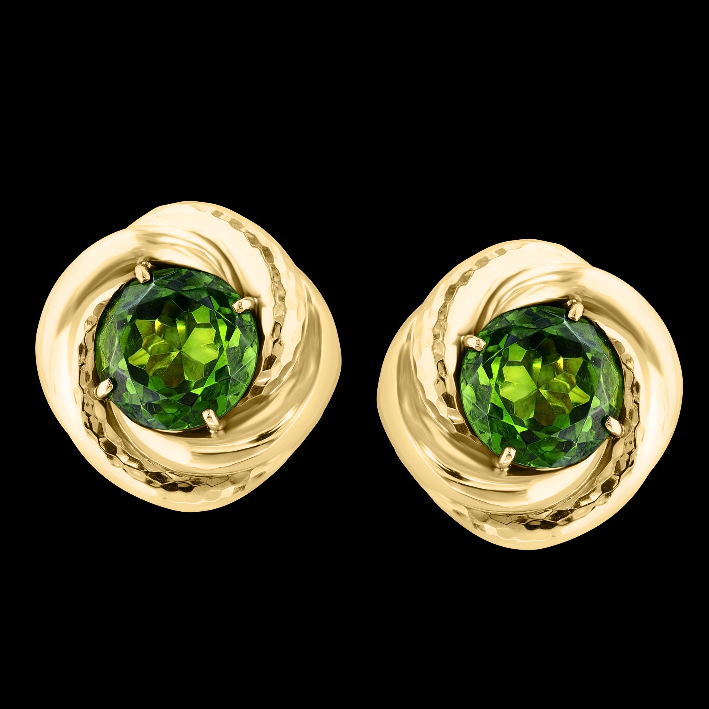 Approximately 30 Ct Natural Round Peridot Earrings by Designer Andrew Clunn in 18 Karat Hammered Gold. Clip-ons
The earrings are perfectly crafted from hammered gold with a honeycomb pattern.
Super large and super nice quality of peridot
This