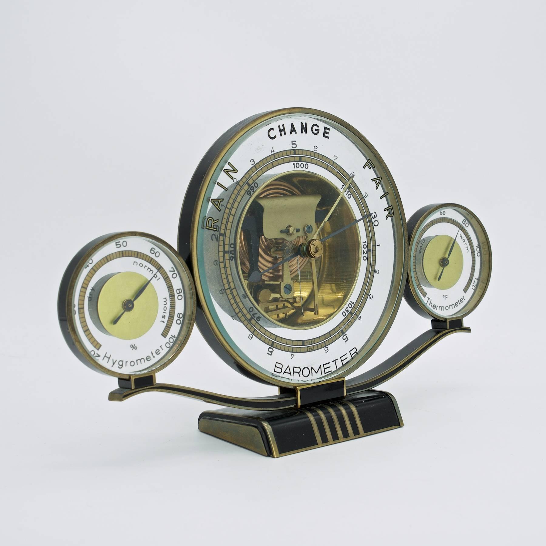 German aneroid barometer, hygrometer, and thermometer. Gold-plated trim and enamel. Wonderful condition free of damage. Rarely seen variation in English. 
Working, was tested 10/12/19 outside on porch, and readings were in line with internet