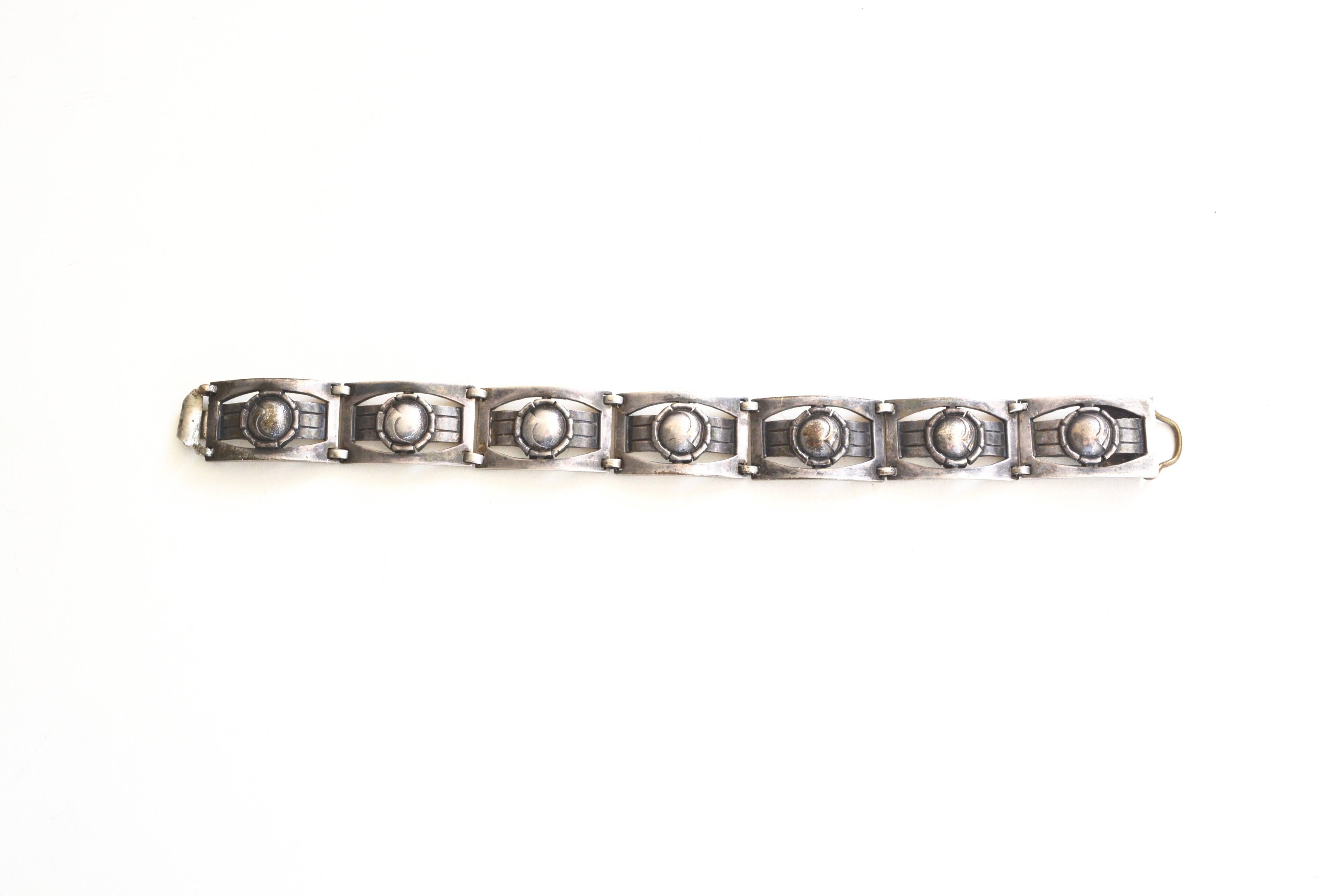 Marked Sterling, Art Deco era sterling bracelet.  The item has no other markings and is tarnished. Otherwise very good condition.  About 7