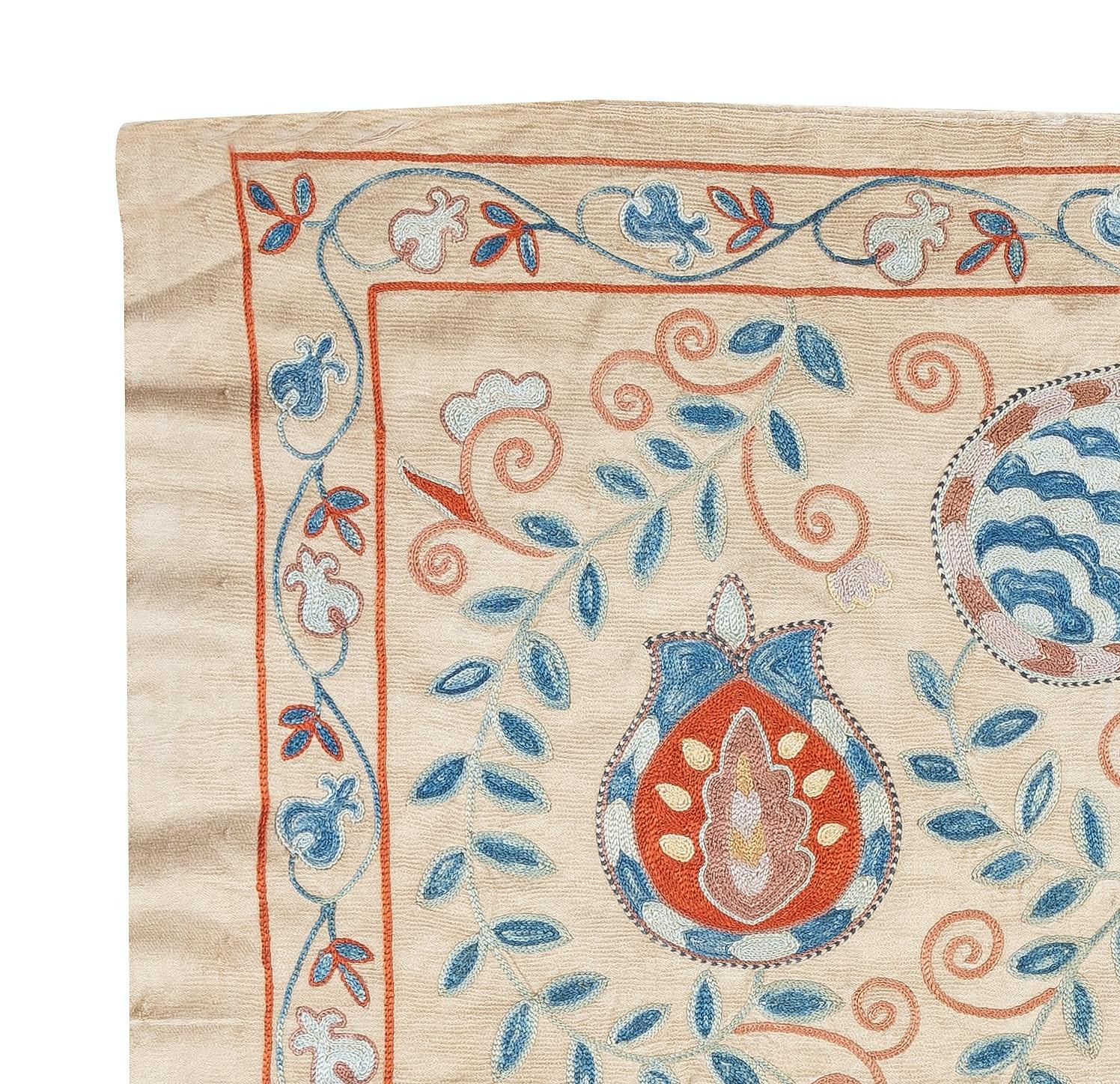 Celebrate the rich heritage of Asian craftsmanship with this exquisite 100% silk Suzani textile, meticulously hand-embroidered by skilled artisans. A true work of art, this piece embodies centuries of tradition, featuring intricate floral and